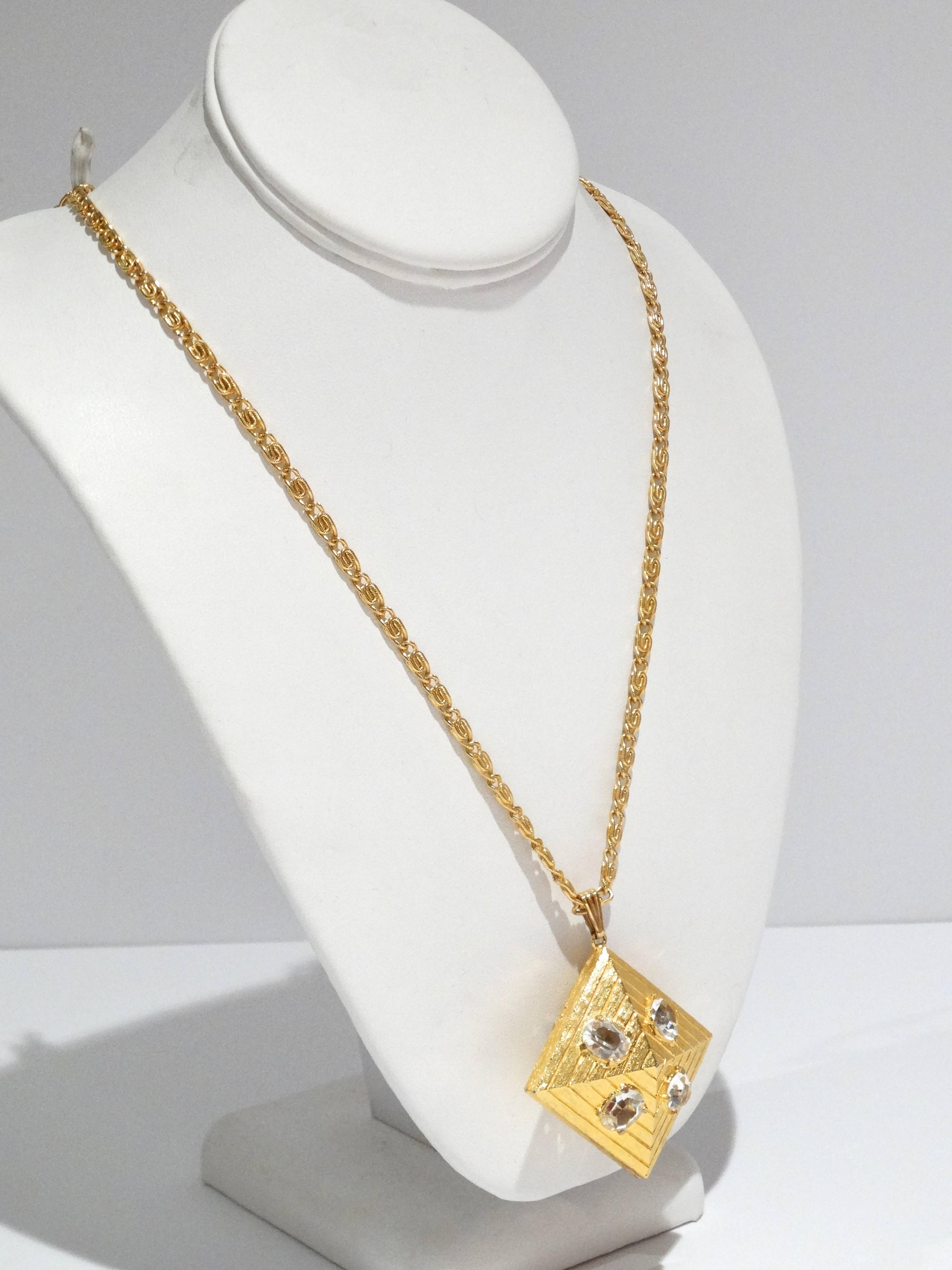 Rare 1970's item by William de Lillo. This is a beautiful gilt 3-D pendent necklace with crystal stone details on both sides of the pendent.  The necklace is 15