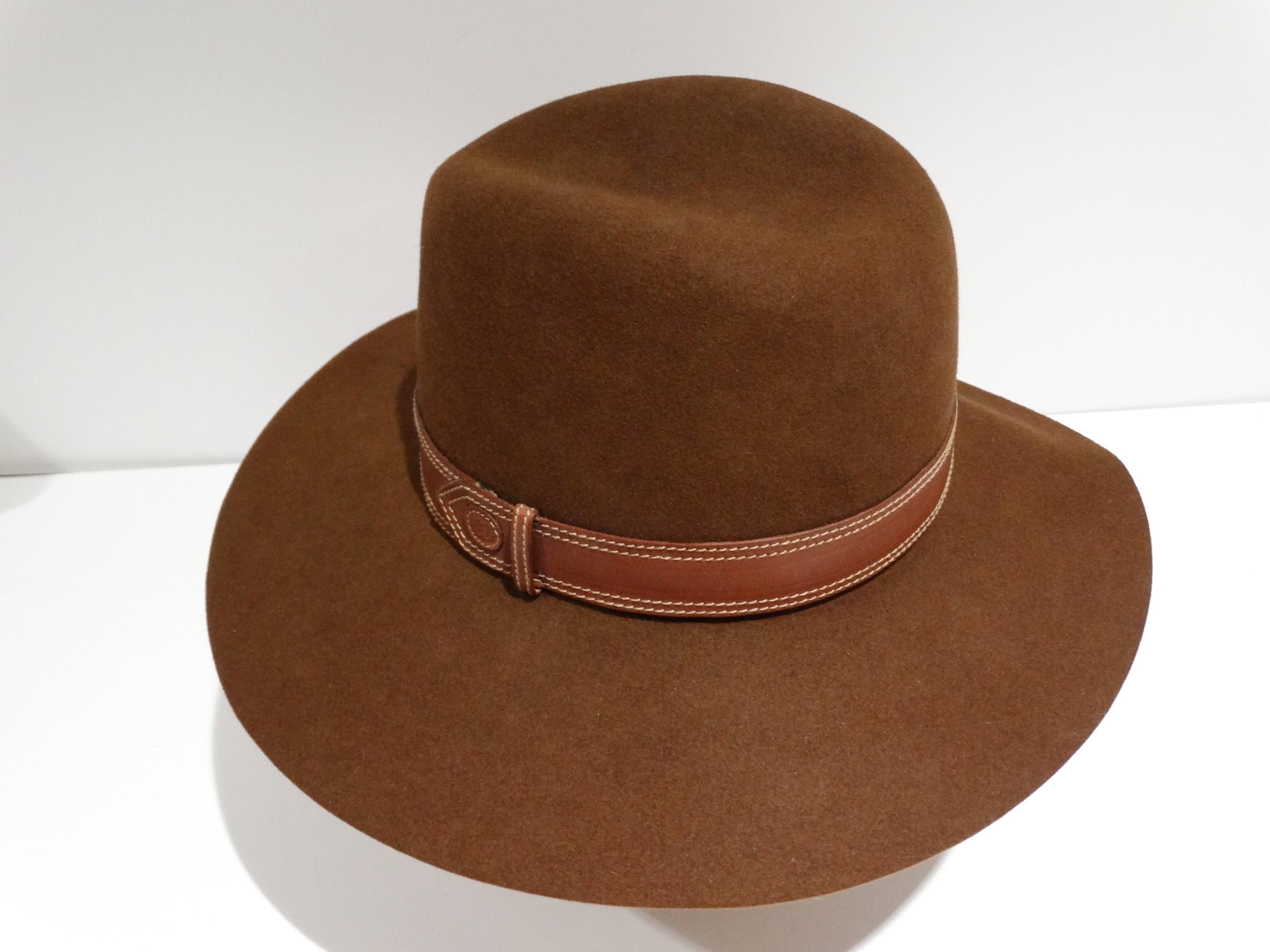 Extremely Rare and Perfect for this fall/winter 1970's Gucci Felt hat in tobacco. This hat is felt and has a wide brim with a leather band. This hat has a bohemian feel to it marked a size 6 1/2 made in Italy 

Measurements: Flat:  3.75