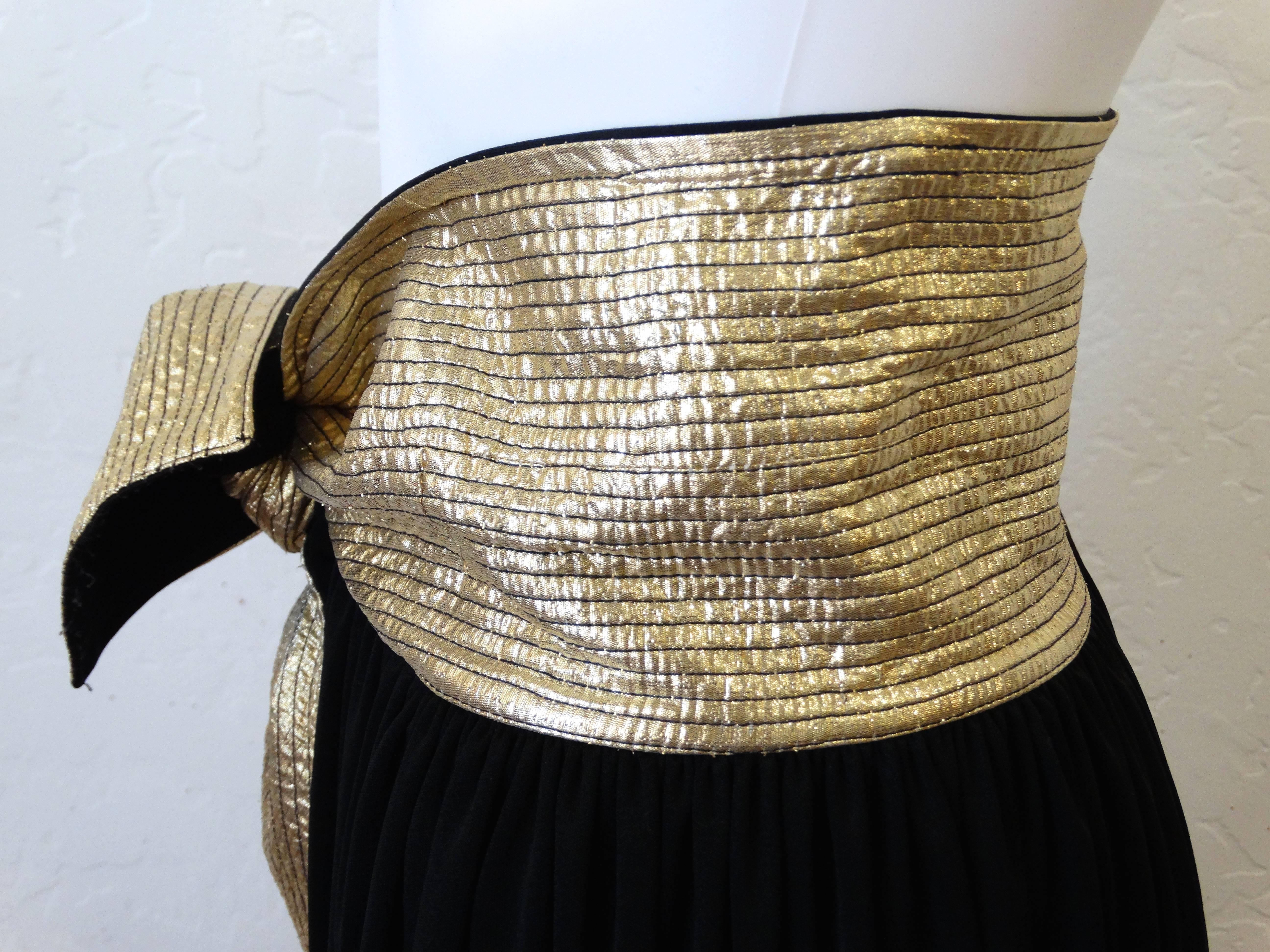 A great staple to add to your wardrobe is this classic maxi skirt with a twist! Designed by Bill Tice circa1980's. This long maxi has an attached gold metallic  leather thick sash belt. Super model length in great vintage condition. No size label