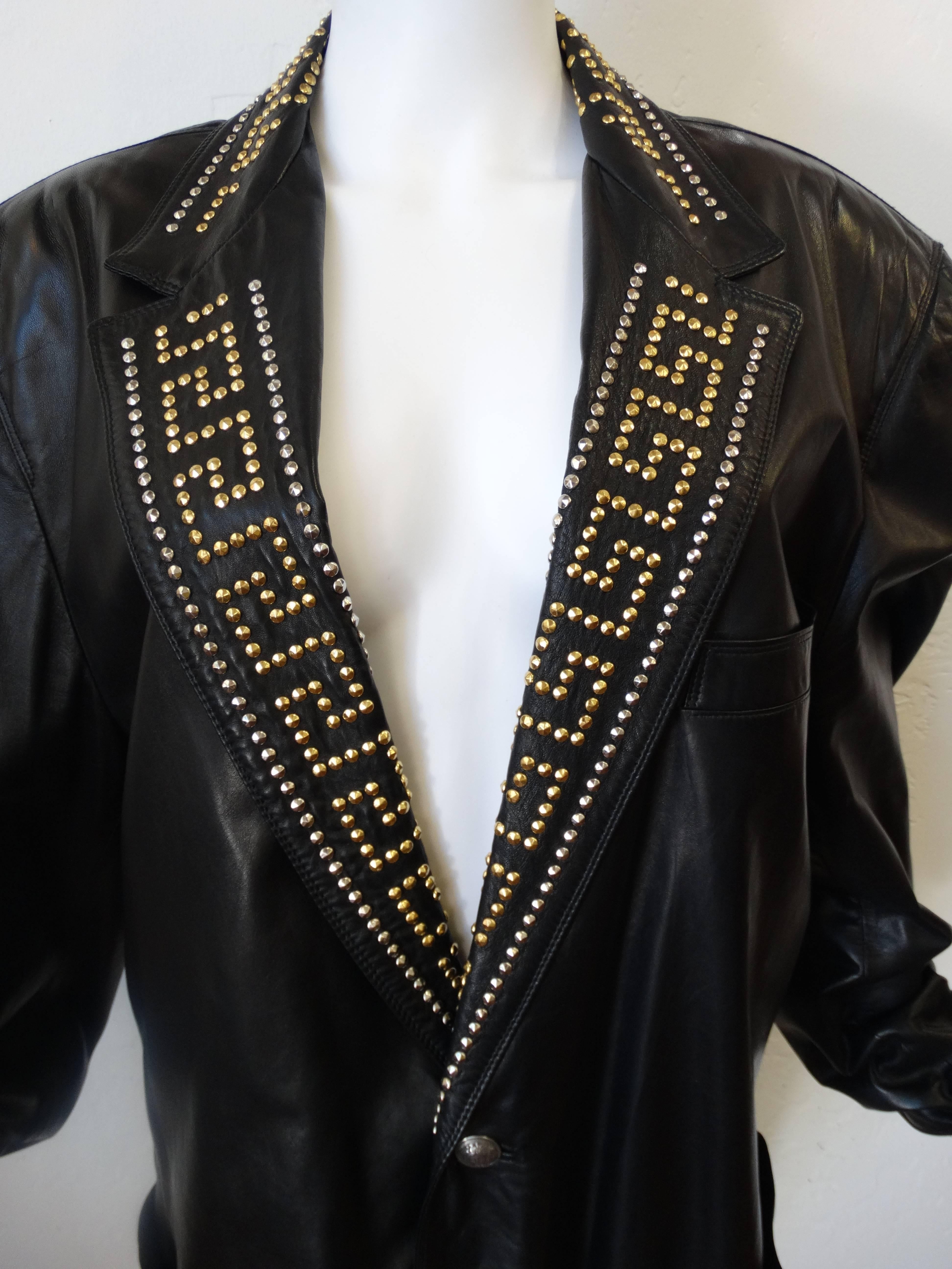 Stunning 1992 Mens Gianni Versace Greek Key studded leather jacket. 2 single medusa head buttons in front. Gold and silver studs in a Greek key pattern along the collar. Classic cut size Ita 48 butter soft leather lined in Versace print silk.