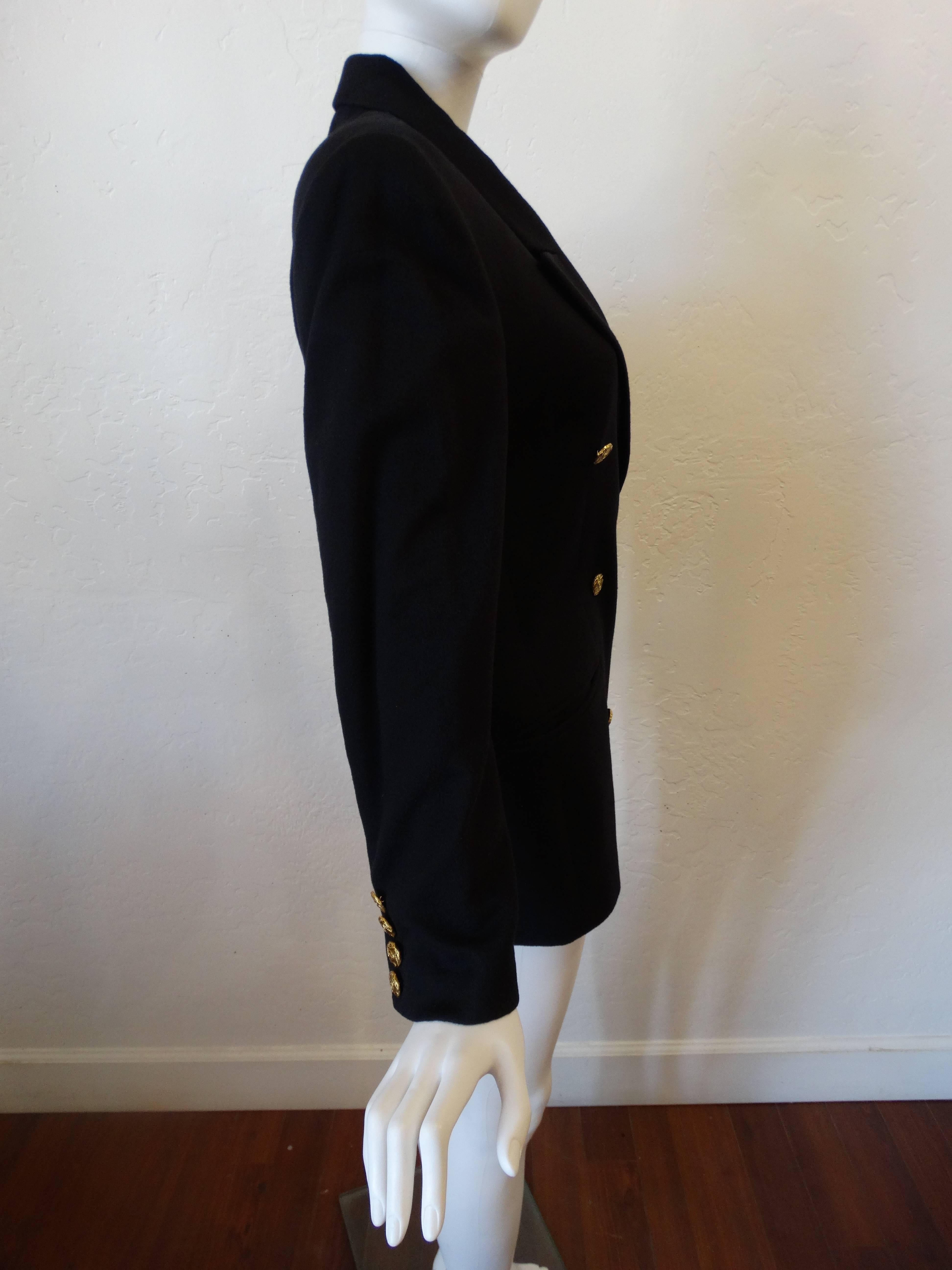 What a beauty! This is a rare find from Gucci created in the mid 1980's when men's wear was huge for women to wear. This coat is 100% cashmere, butter soft and is in a deep Navy. It has large gold GG buttons (see close up in images) such a classic