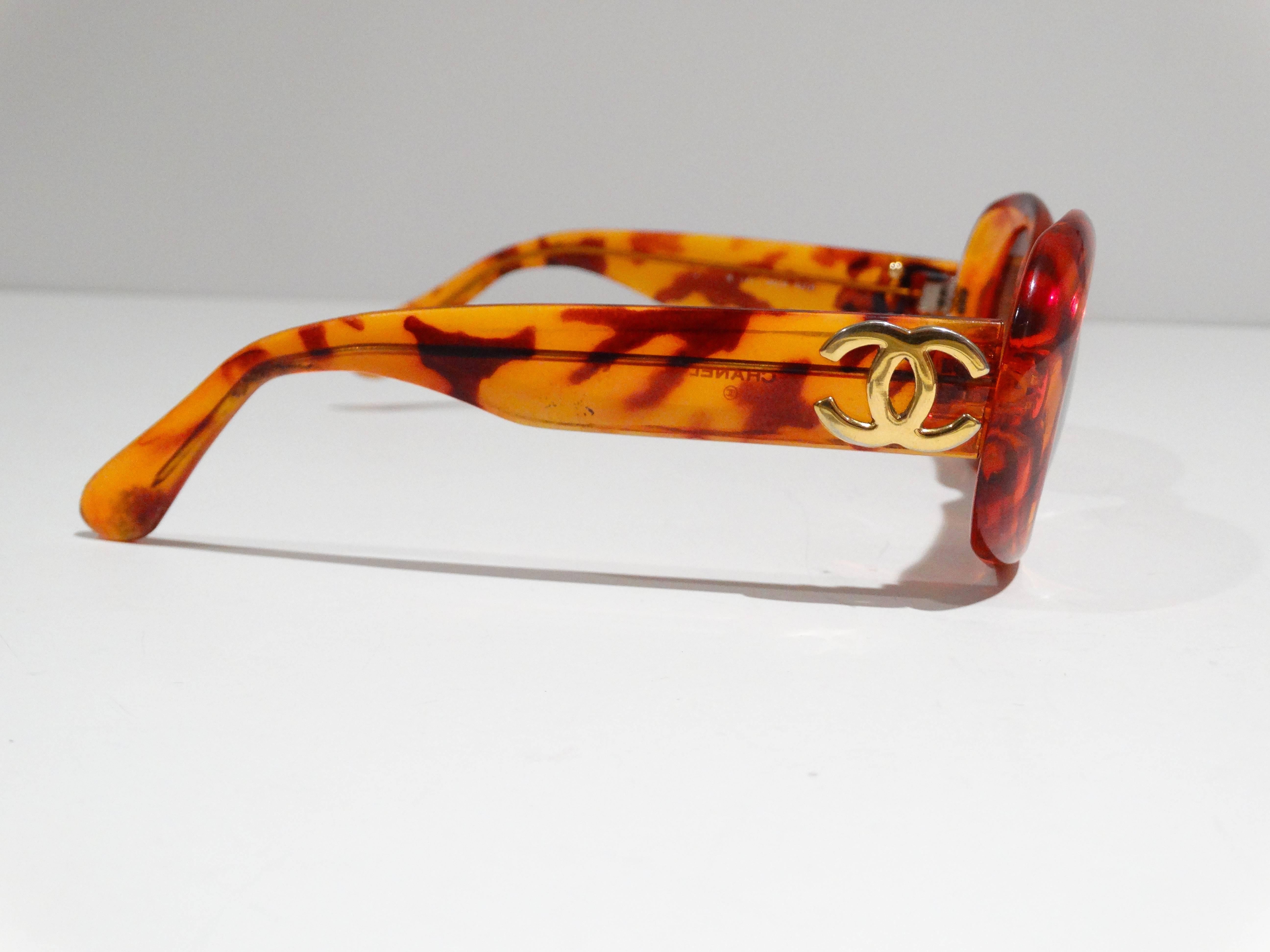 A fabulous pair of 80's Chanel sunglasses in tortoiseshell style frame with the perfect amber tint to the lens. Gold logo CC on the outside of each side of the frame. Sunglasses are marked made in Italy these glasses have a perfect vintage shape. 