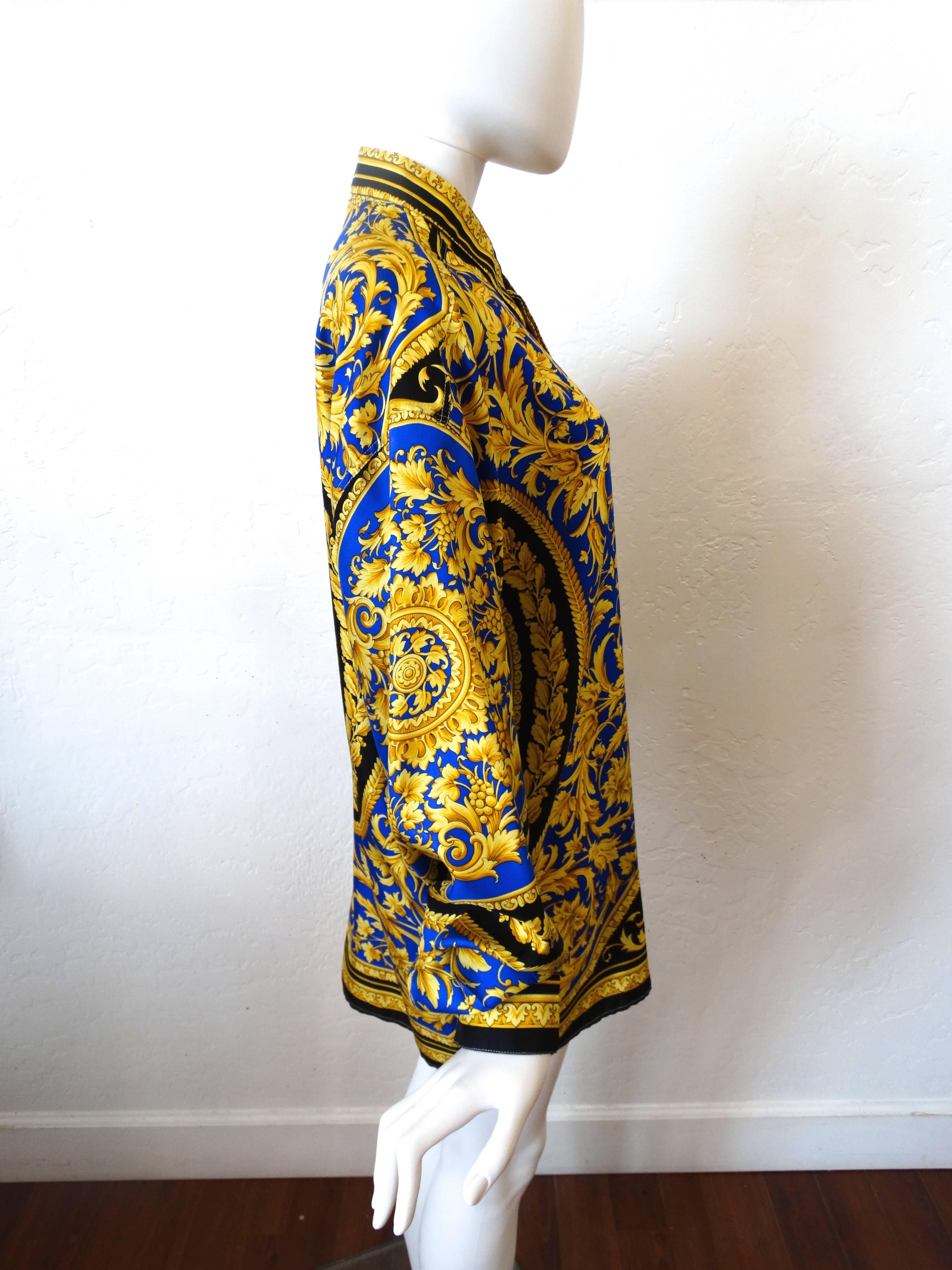 Classic 1990's Versace V2 Barocco print silk shirt in colbalt blue and gold. Circa 1994 Size 48 M Great look for female or male. 

 Measurements in flat are approx:

Shoulder width (measured from shoulder seam to shoulder seam) =  24.5
