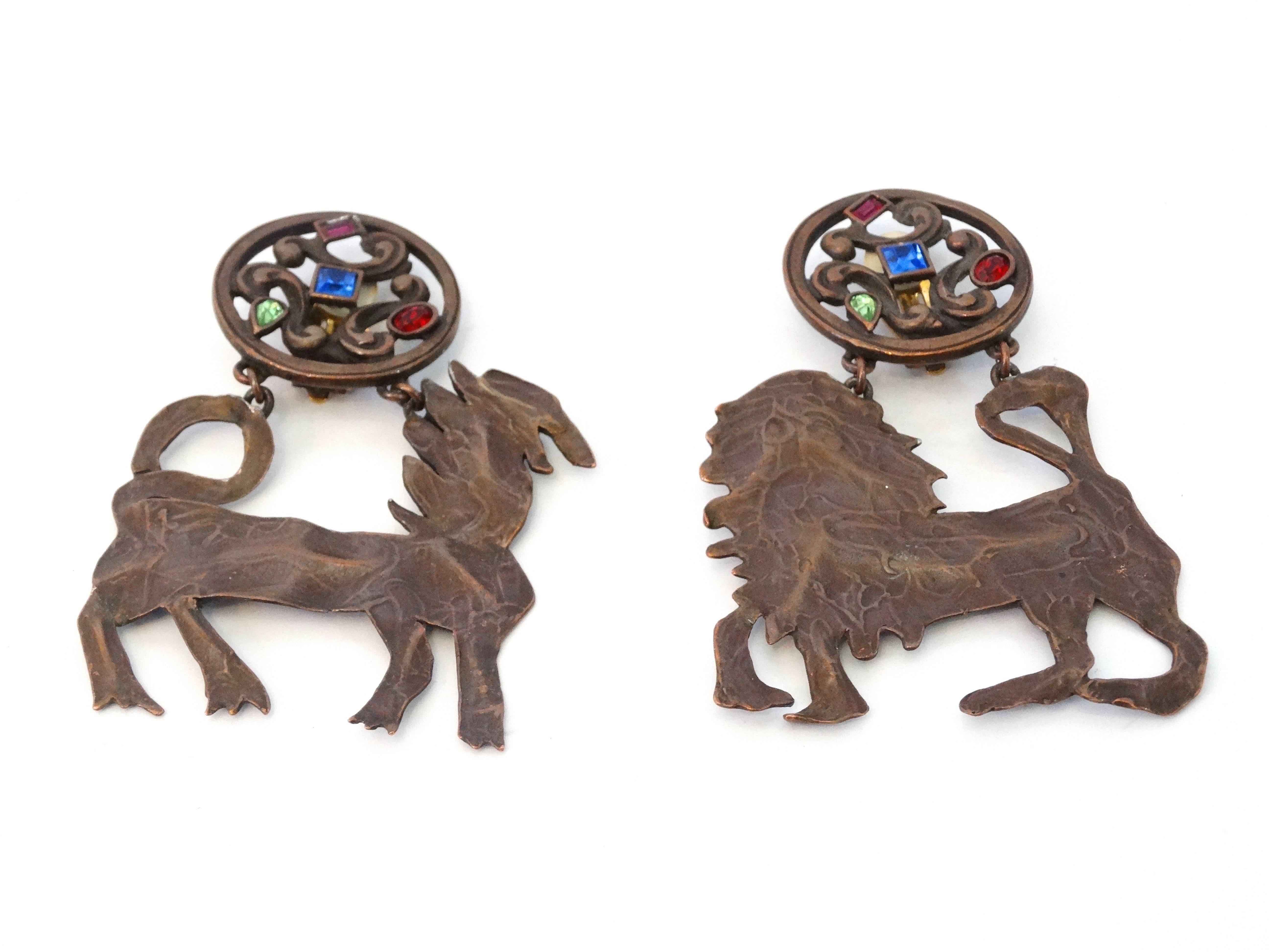 Highly collectible 1970's Yves Saint Laurent rive gauche  animal sculpture clip earrings with colored crystal stones , I see a lion and horse when I look at these beauties. Large in scale signed on both earrings. 3.5 inches long by 2.5 inches wide. 