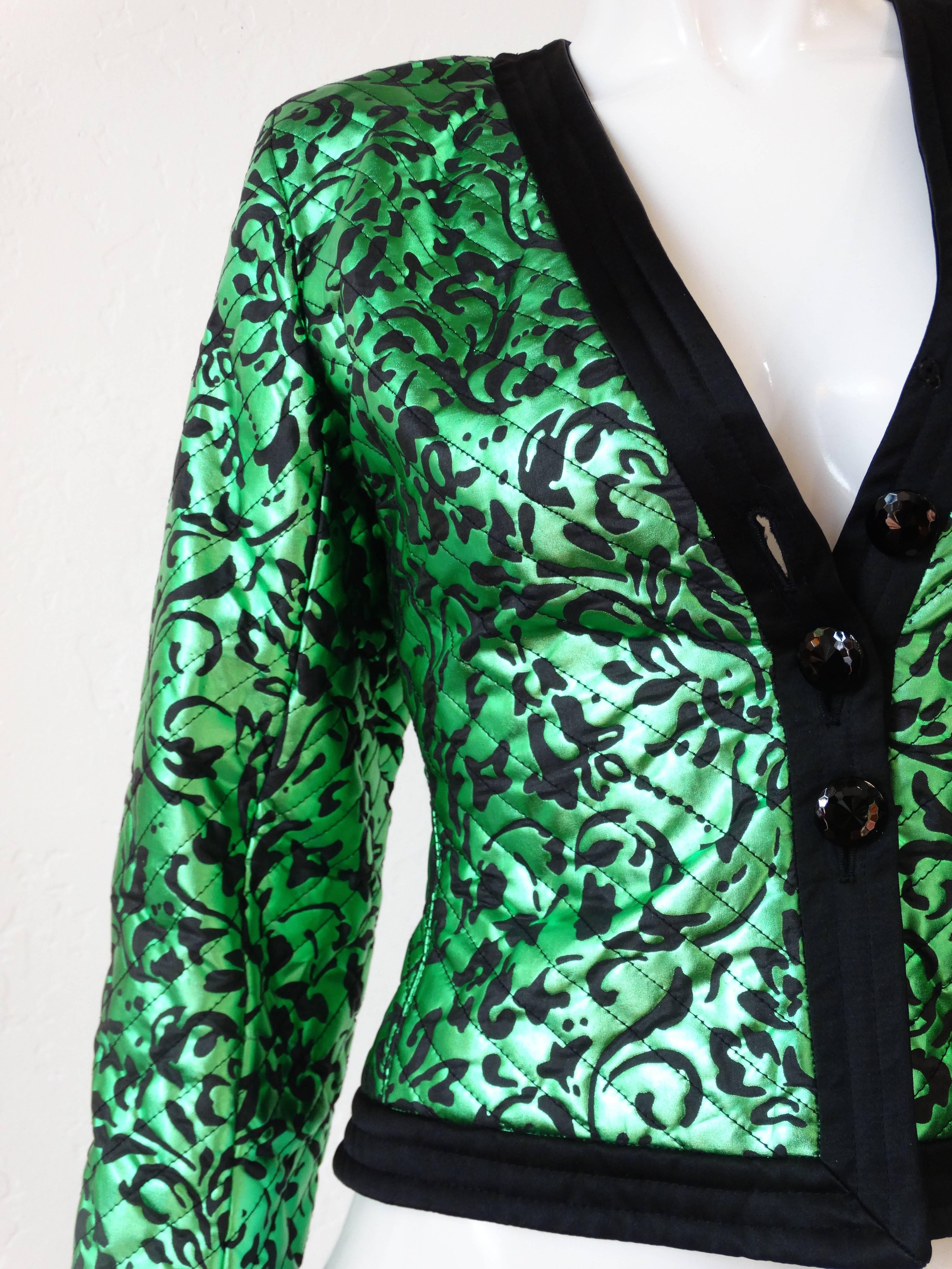 A Fabulous Vintage Saint Laurent  rive gauche bright metallic green jacket with a beautiful floral scroll print,  a deep v-neck and 3 crystal cut buttons Made of soft quilted metallic silk. Trimmed in a textured silk, and lined in silk,   

Size: