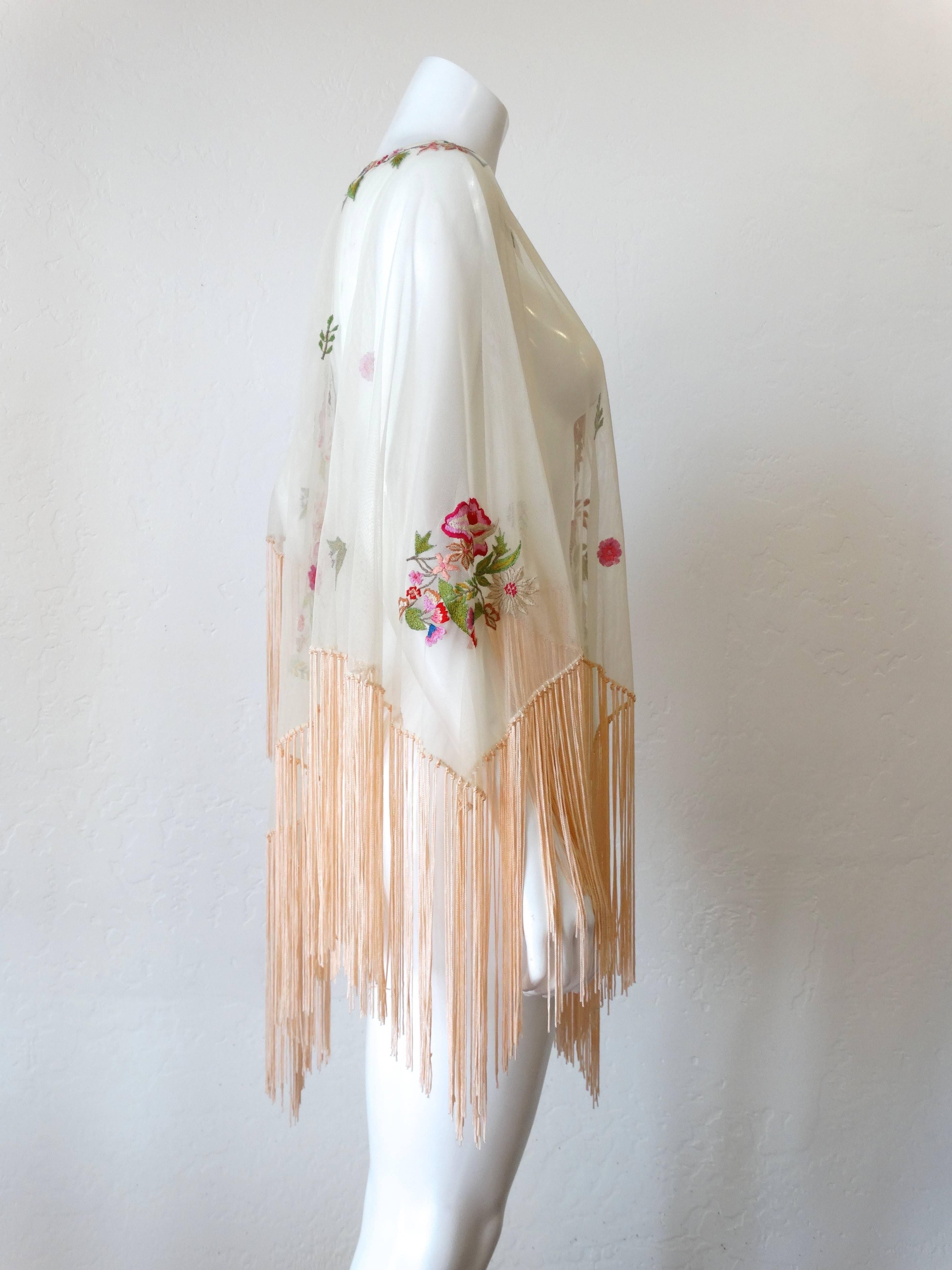 Original 1930's Sheer Tulle and Pink Handmade, Hand Embroidered 100% Silk fringe and threads. Poncho has hand knotted silk fringe in creamy peach. Features brilliant silk embroidery with pink, red and white flowers with red and green stems and