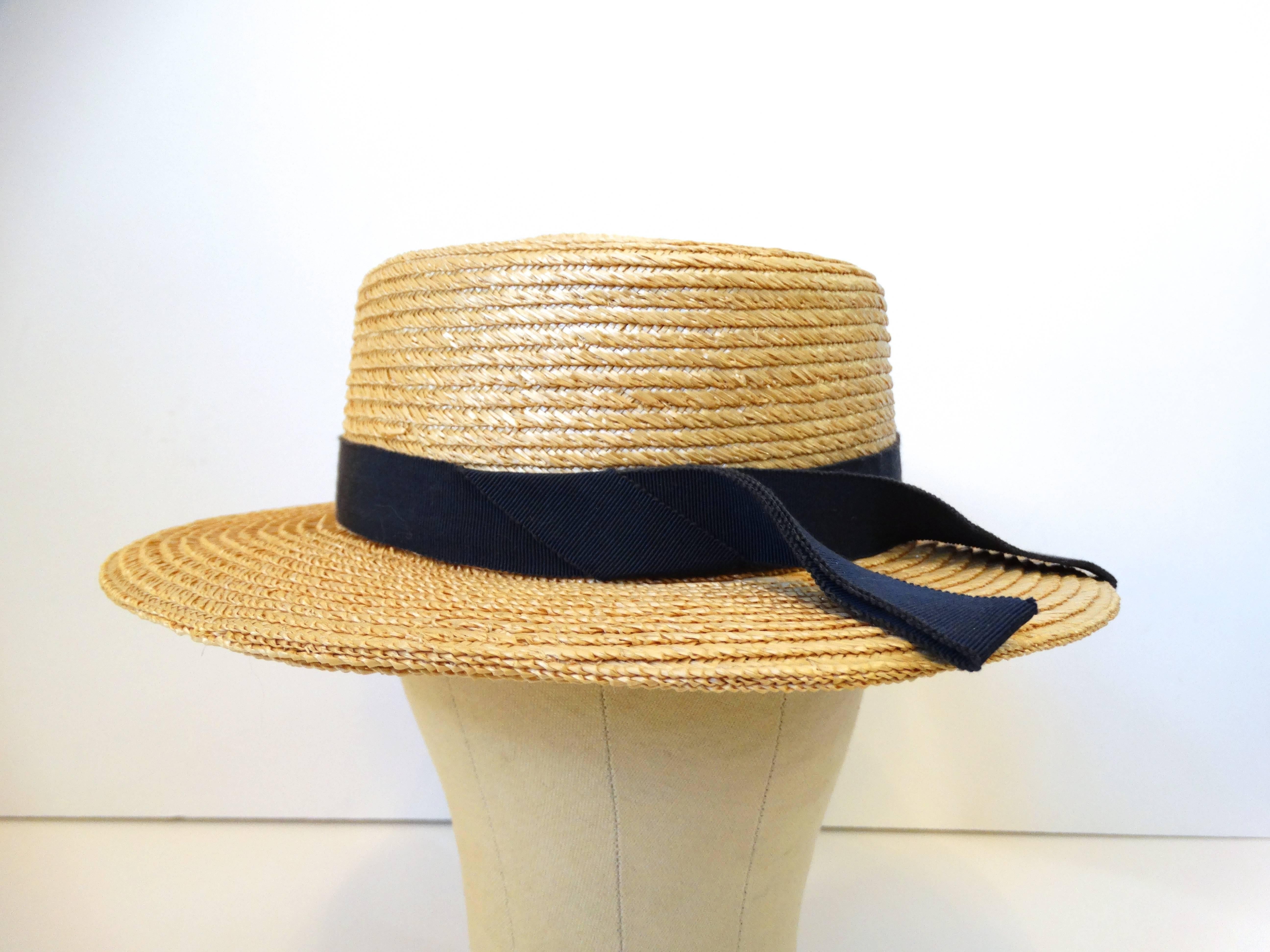 Rare 1980's Yves Saint Laurent Rive Gauche boater straw hat with a contrasting navy ribbon. Made In France. Style/model A458 Measures: 14