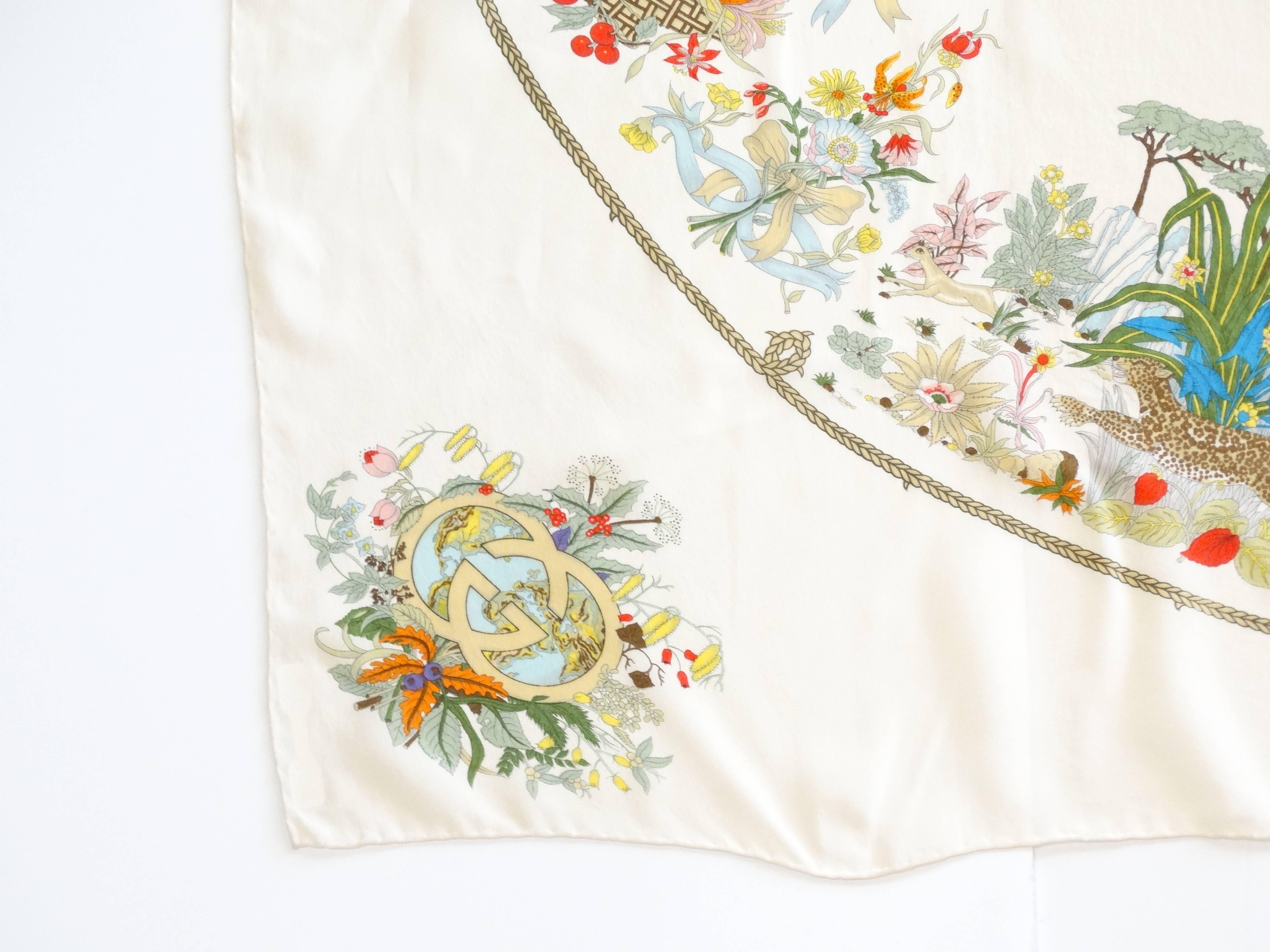 Delicate and beautiful V. ACCONERO design for GUCCI, rare silk chiffon with hand rolled edges 40' square with beautiful motifs of florals, the sea, the jungle and golden harvest. Designed in the 60's printed in the early 70's. Gucci Logo motif in