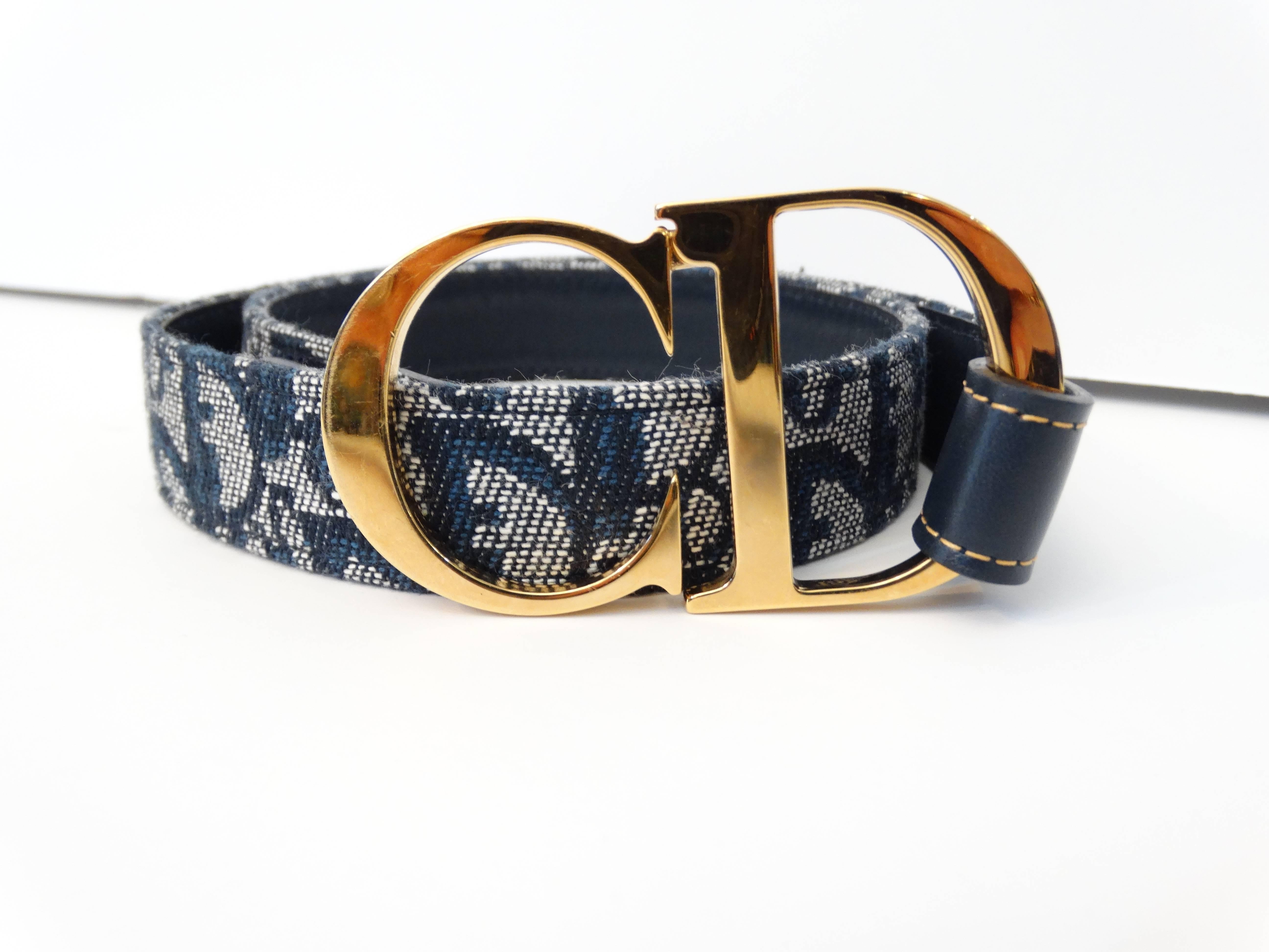 1990's fresh navy Diorissimo canvas Christian Dior belt with gold-tone hardware, tonal leather trim and 'CD' logo clasp closure Classic Dior 
Designer size 70. The gold hardware 