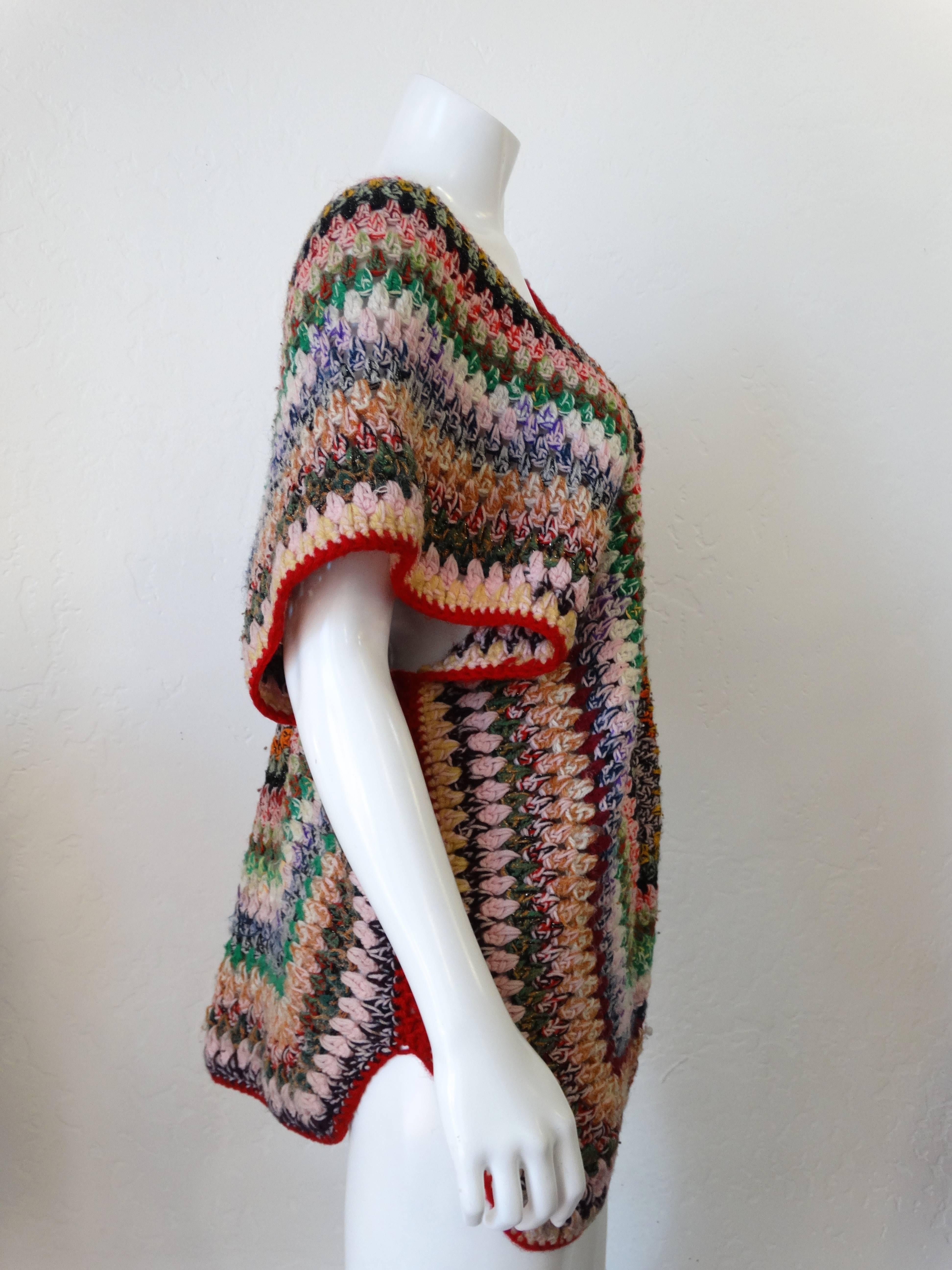 Incredible 1970s hand knit MULTI COLORED poncho top! Psychedelic Granny square-like multicolored knit with deep v neck drapes perfectly over the body.  Poncho like fit with V neck-line and plunging back. Found in Israel ....Unknown Designer 

Bust: