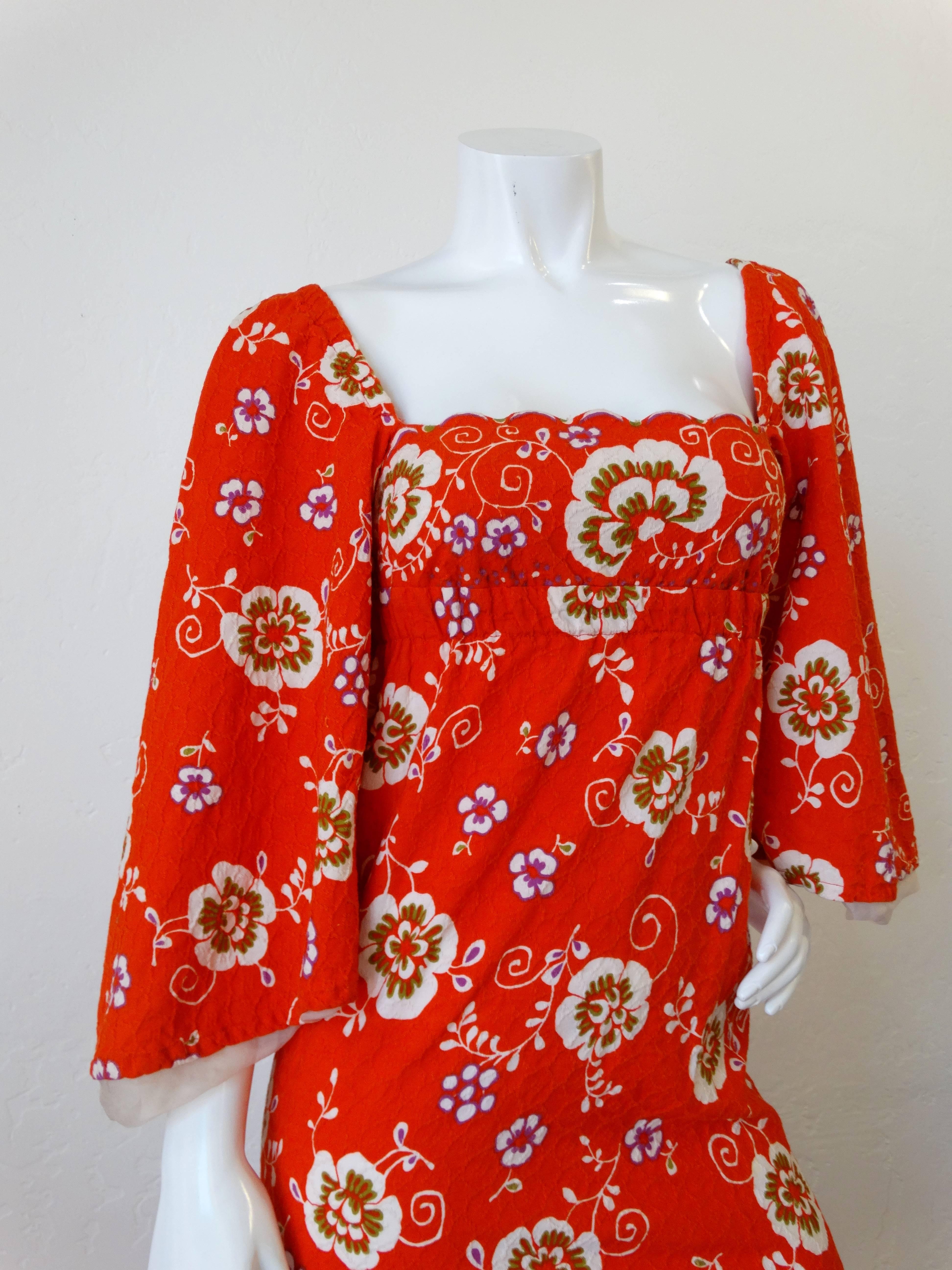 Fabulous 1970s Betty Carol for Christopher Jones bell sleeve maxi dress! Burnt orange, white, purple and green graphic floral print. Elasticized sleeves can be worn on and off the shoulder. Flattering square neckline with scalloped edges. Textured