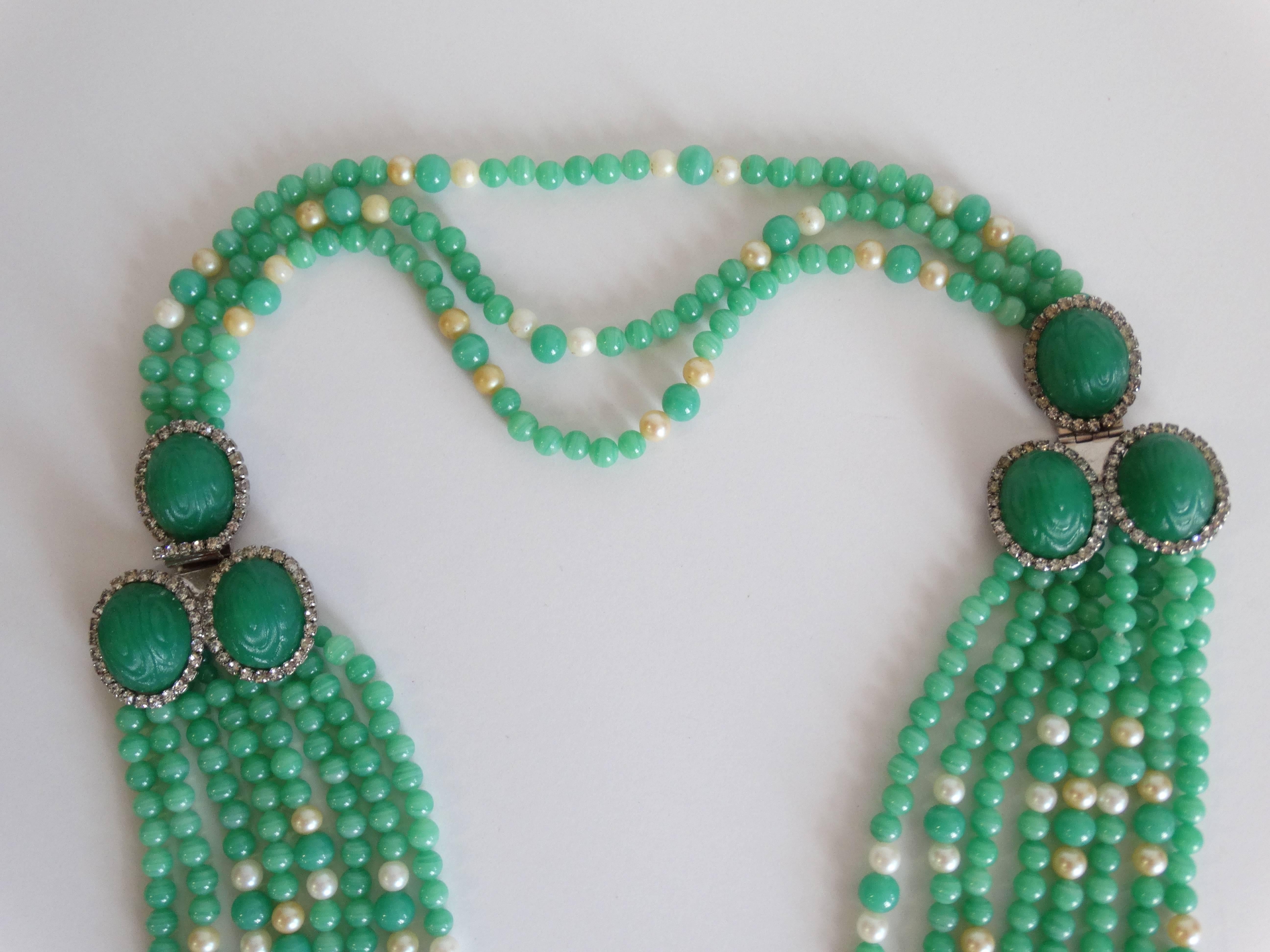 1970's William de Lillo 8 strand necklace made of Jade and faux Pearls! Double side clasp clusters of green cameo glass surrounded by crystal rhinestones. Faux pearls are speckled through out. Signed del Lillo  a very elegant piece. On the back 3