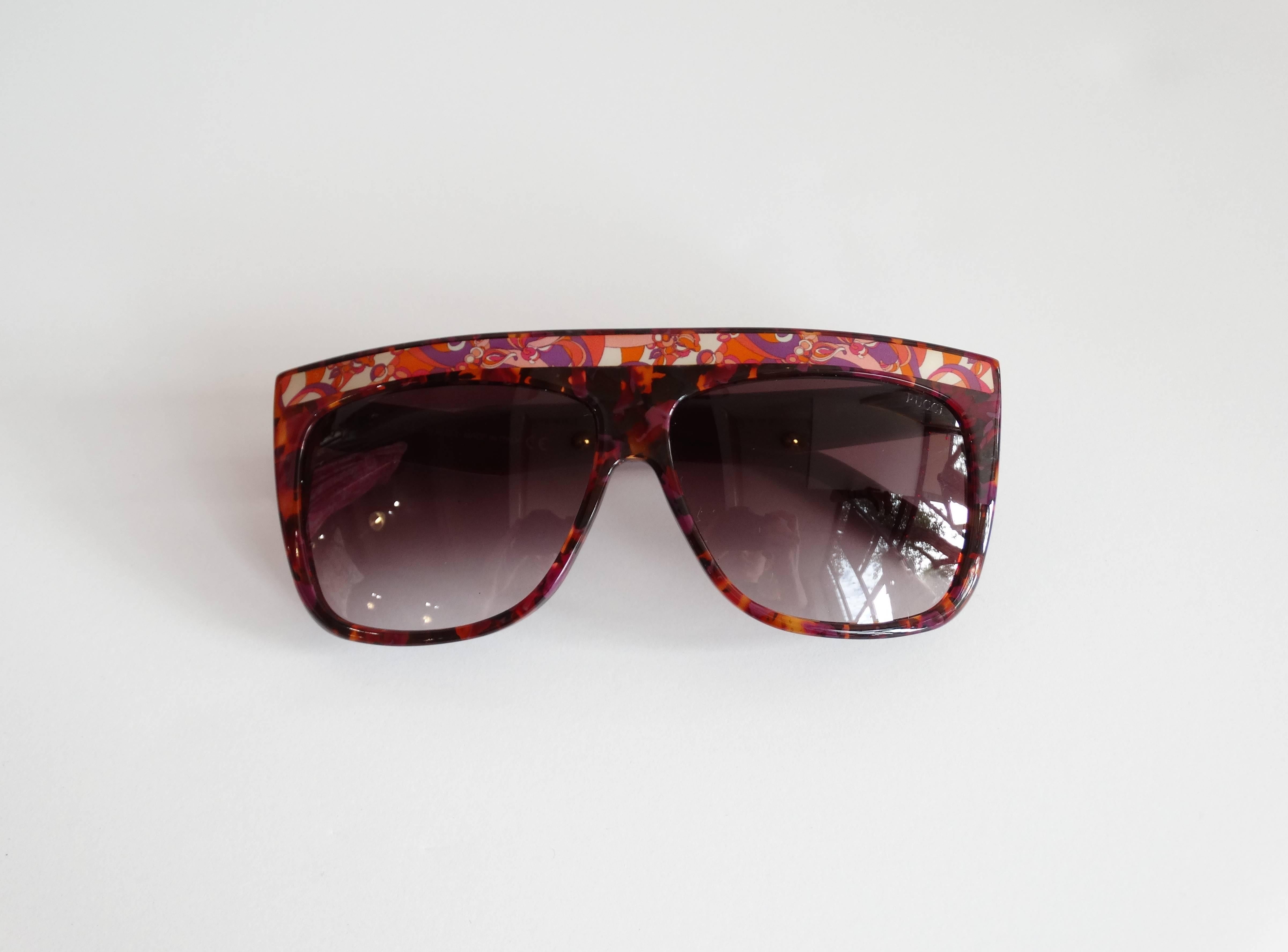 Fabulous 1990s Emilio Pucci Sunglasses! Multicolored tortoise shell confetti with Pucci’s signature psychedelic prints along the brow and arms. Comes with original carrying case and bag. Made in Italy 5 1/2 inches across the brow 
