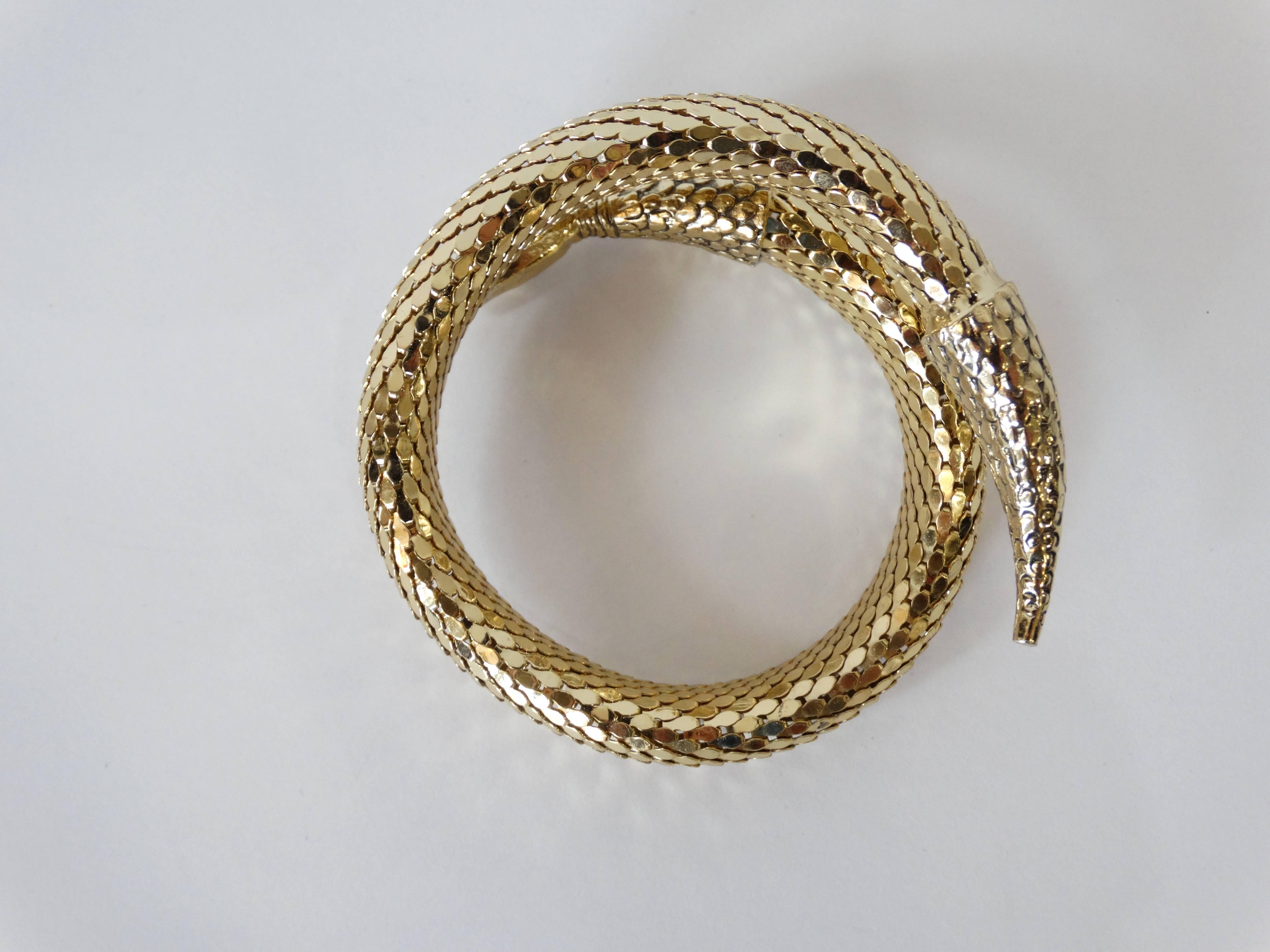 1970's coiled snake bracelet from Whiting and Davis. It is made out of Whiting and Davis' signature gold-chain-mail mesh. It measures 1.5