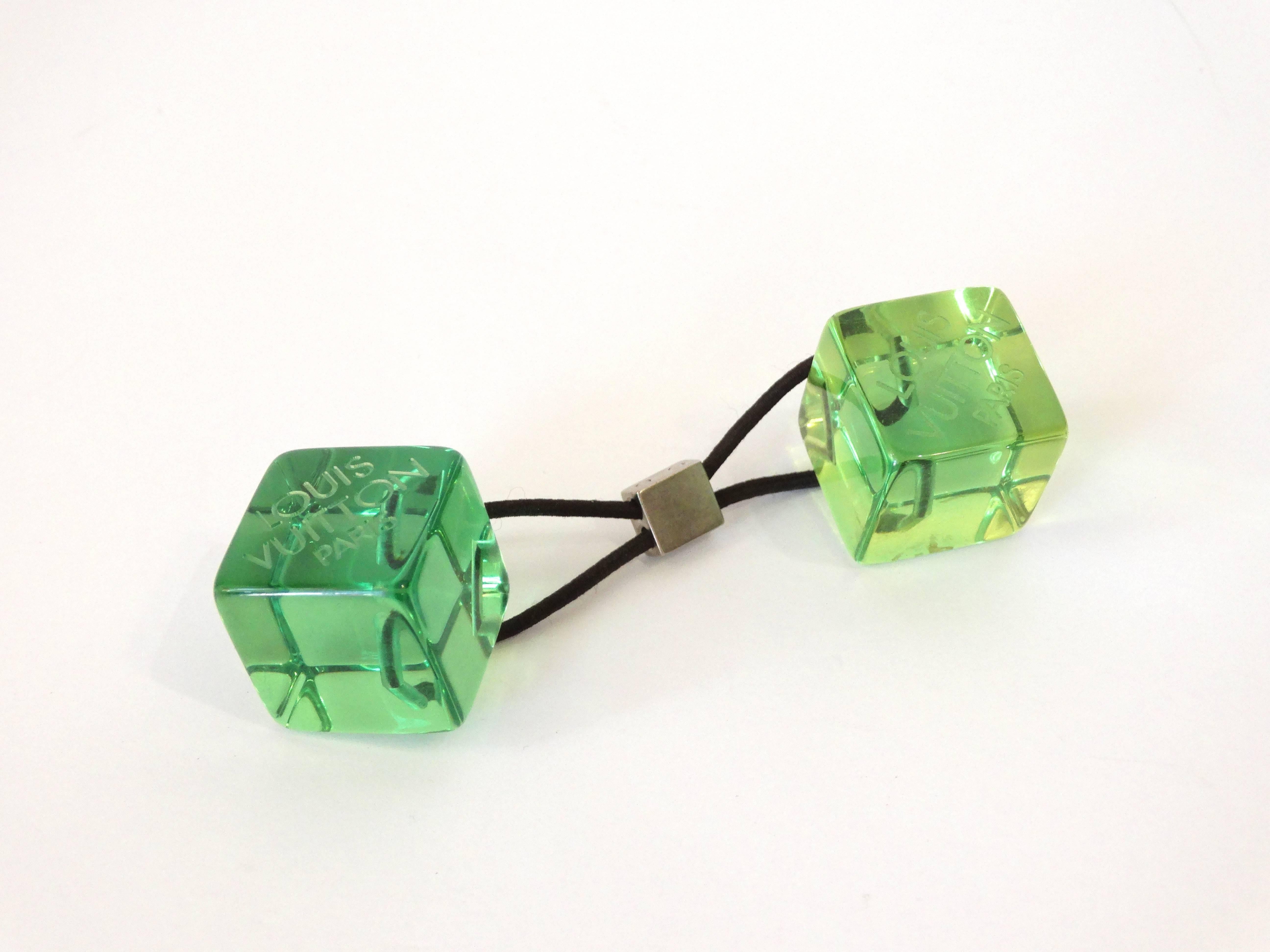 Add some fun to your hair with this adorable Louis Vuitton Green Resin Hair Cube! Louis Vuitton Paris etched into the resin. Stretchy hair band. Measures 
5in length. 