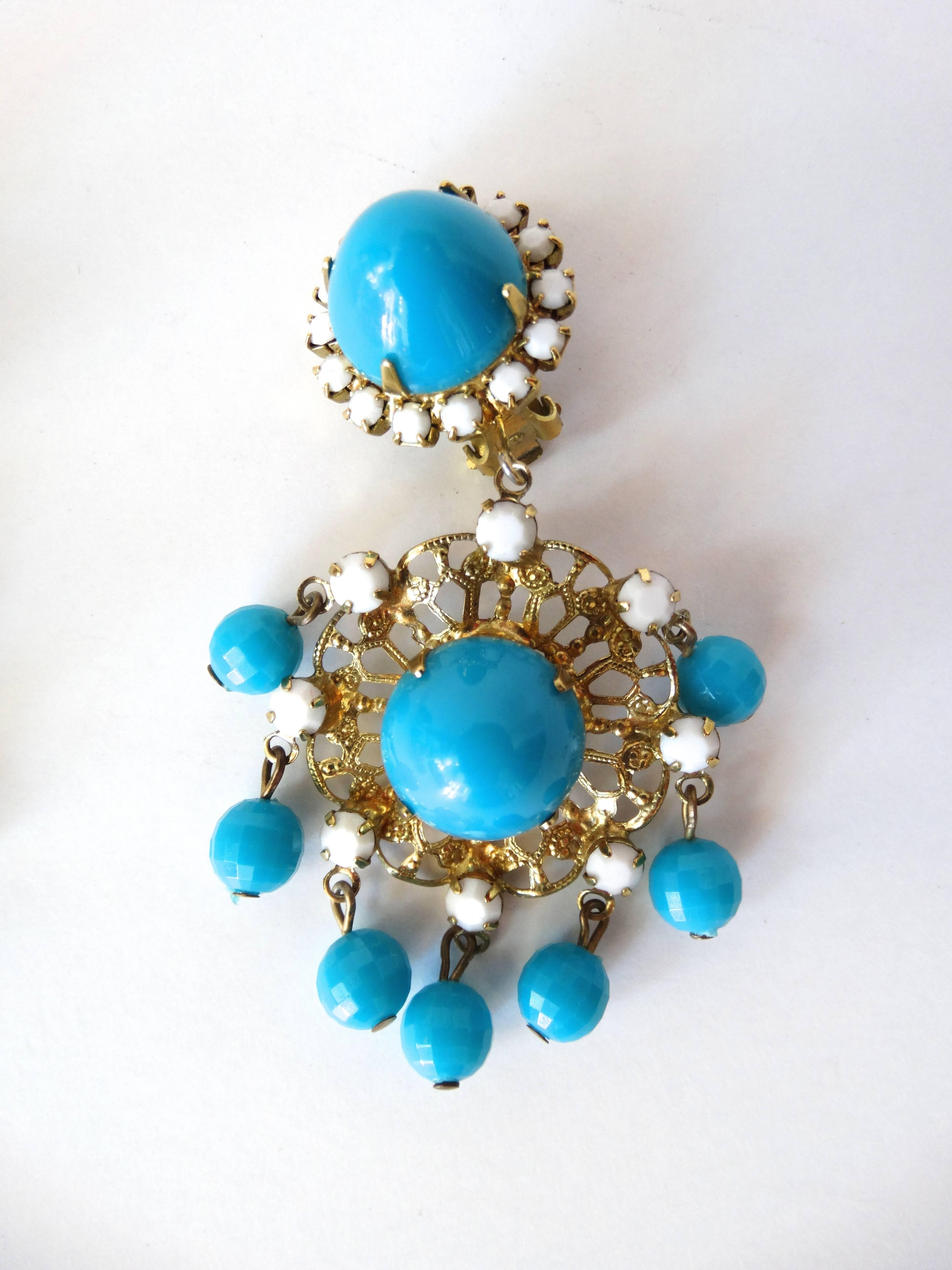 late 1960's Kenneth Jay Lane K.J.L earrings are clip-on chandelier style with plastic turquoise cabochons and beads.  There are also white glass rhinestones, base is gold tone filigree. Fun and Light weight . The earrings are 2 3/4