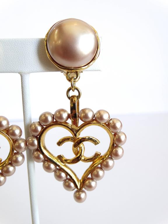 Chic 1990s Chanel Pearl Heart Drop Earrings at 1stDibs | chanel pearl heart  earrings, chanel heart pearl earrings, chanel heart drop earrings