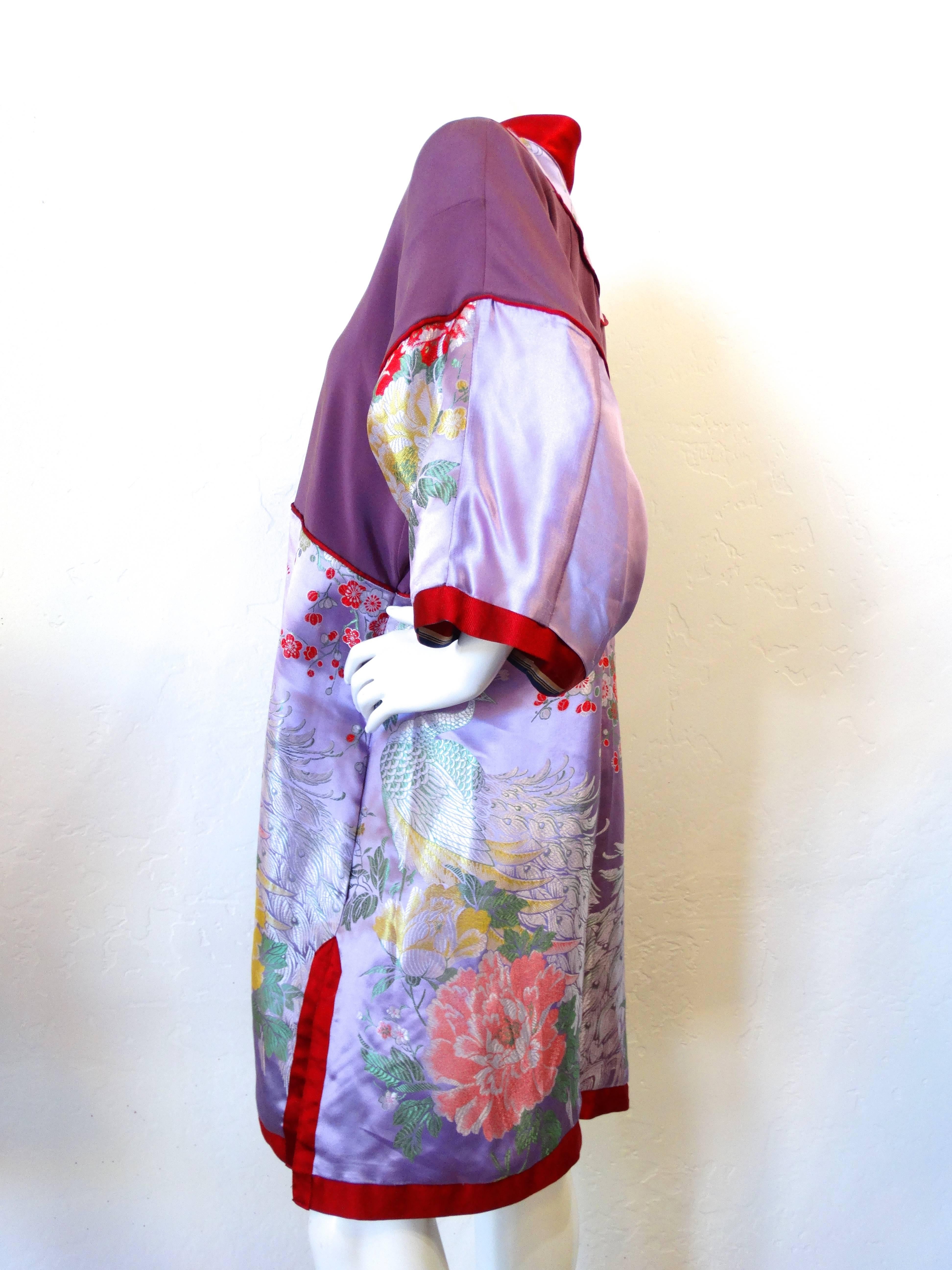 This piece is one of a kind, handmade in the 1960s. Pieced together from several different silks- this piece is set to stun! Lilac embroidered Japanese silk with botanical and peacock motifs. Baby pink kimono closures up the bust line. English