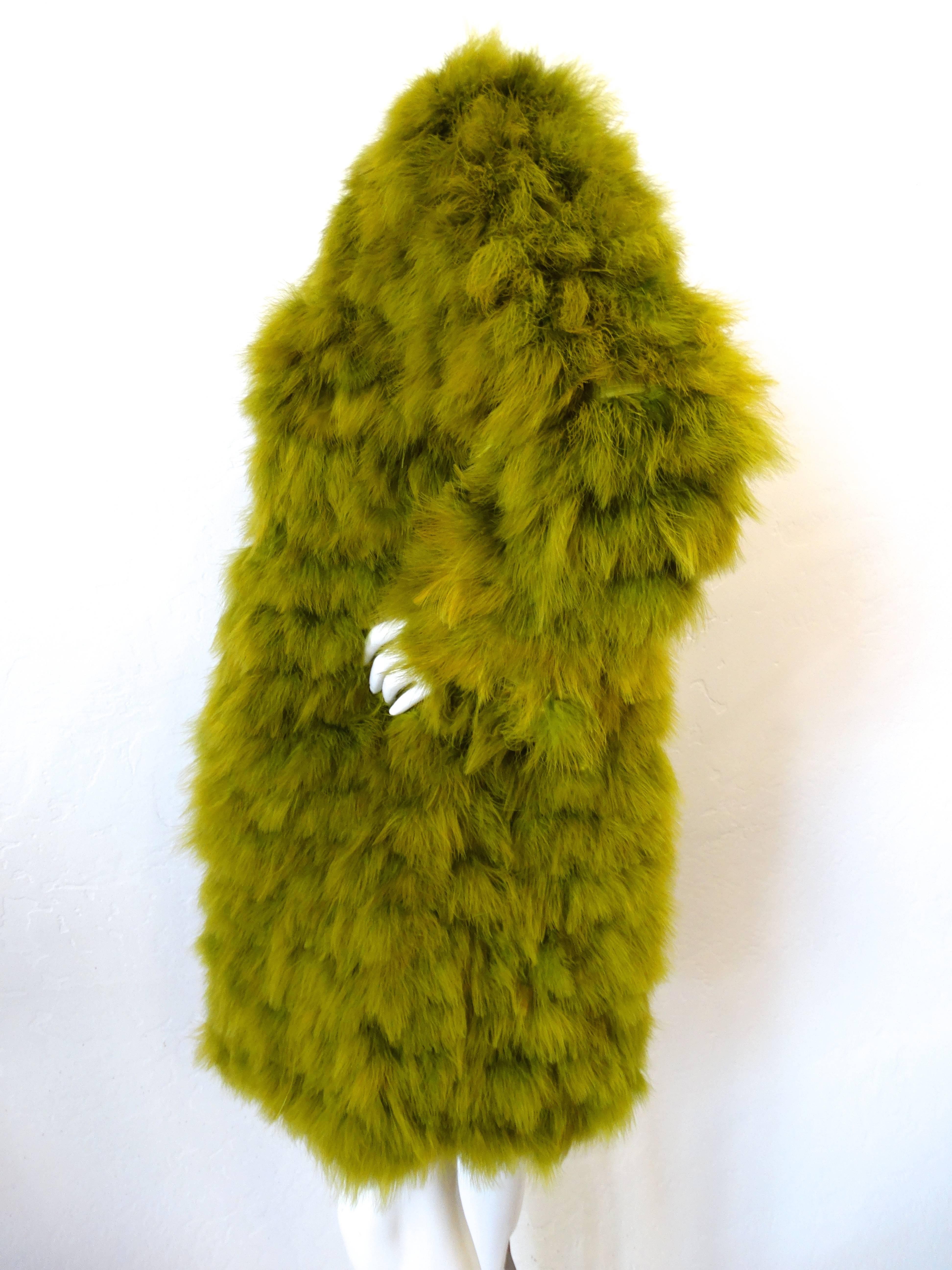 This piece is straight off the runway from Lanvins 2006 ready to wear collection comes to you a beautiful chartreuse feathered coat. Fully lined in silk with reversed stitching edges. This jacket has an over sized cut with hook closures going up the