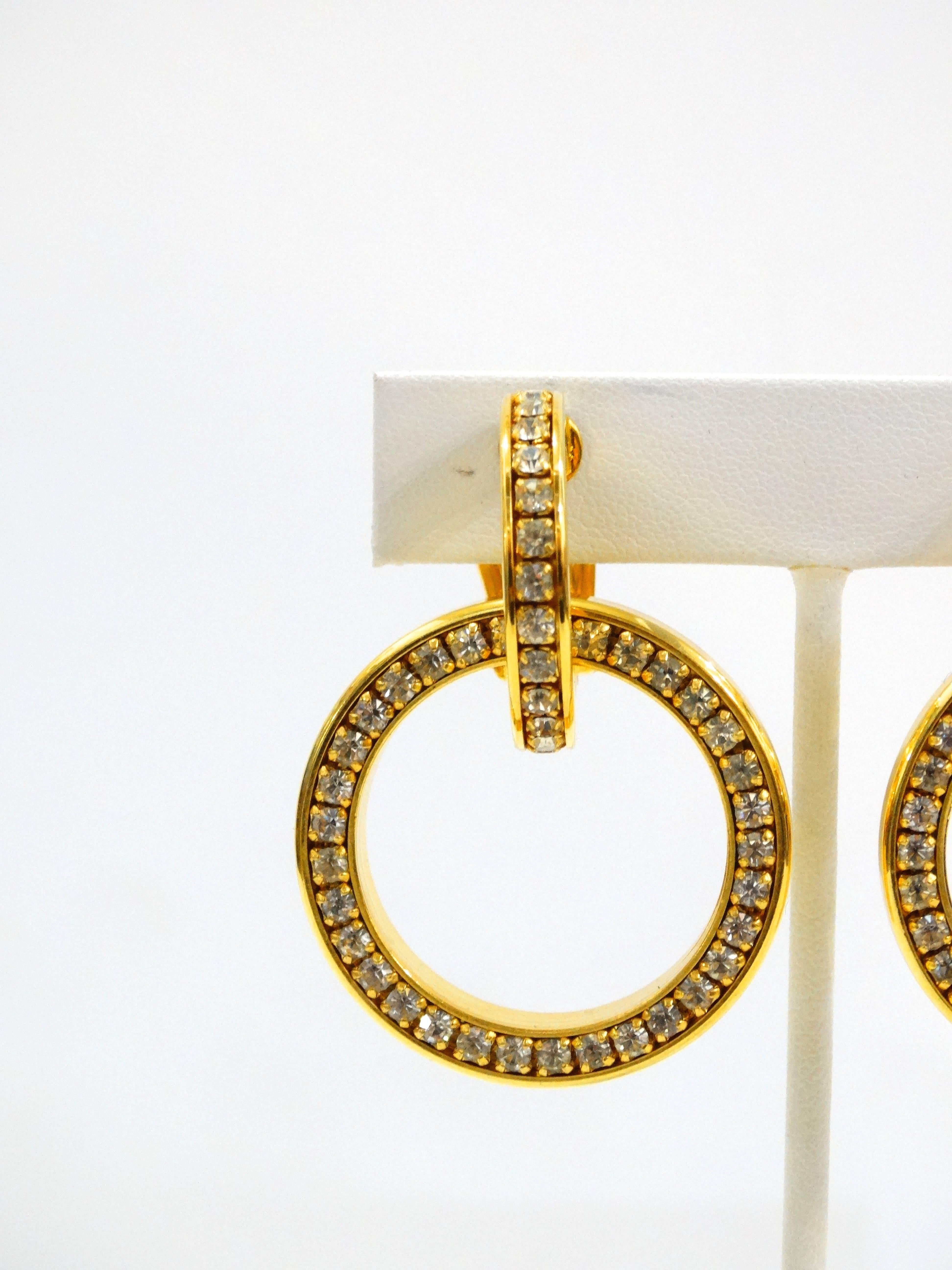 Classic Valentino double hoop clip on earrings cast in a brilliant gold metal! Accented with clear rhinestones. Signed at the back of the clasp with Valentinos signature V watermark Made in Italy 

2.5 inches long by 2 inches wide 