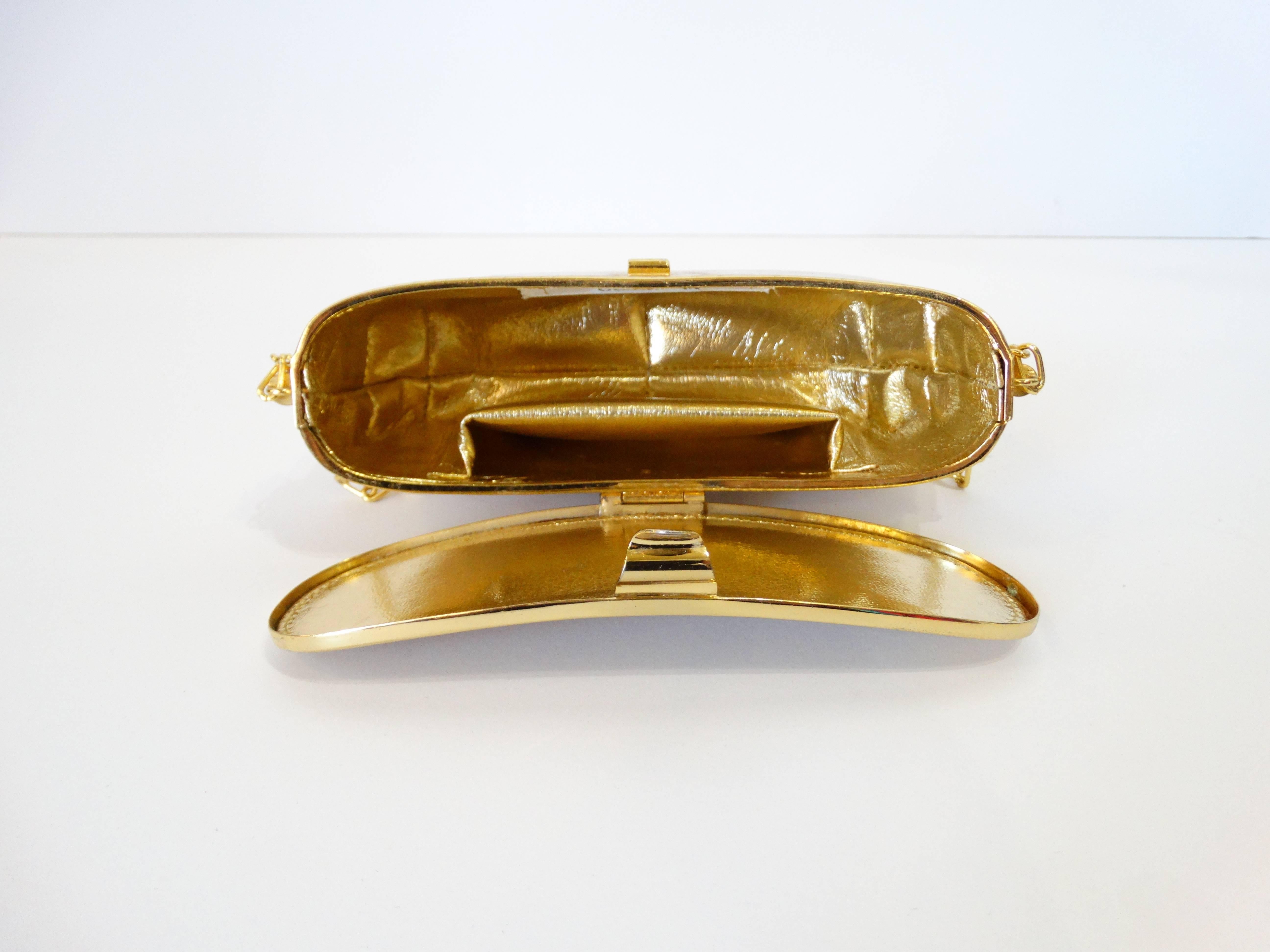 Classic brushed gold metal bean shape clutch by Rodo for Bergdorf Goodman Made in Italy.  Perfect evening bag with metallic gold lining in gold leather. The strap has a 22