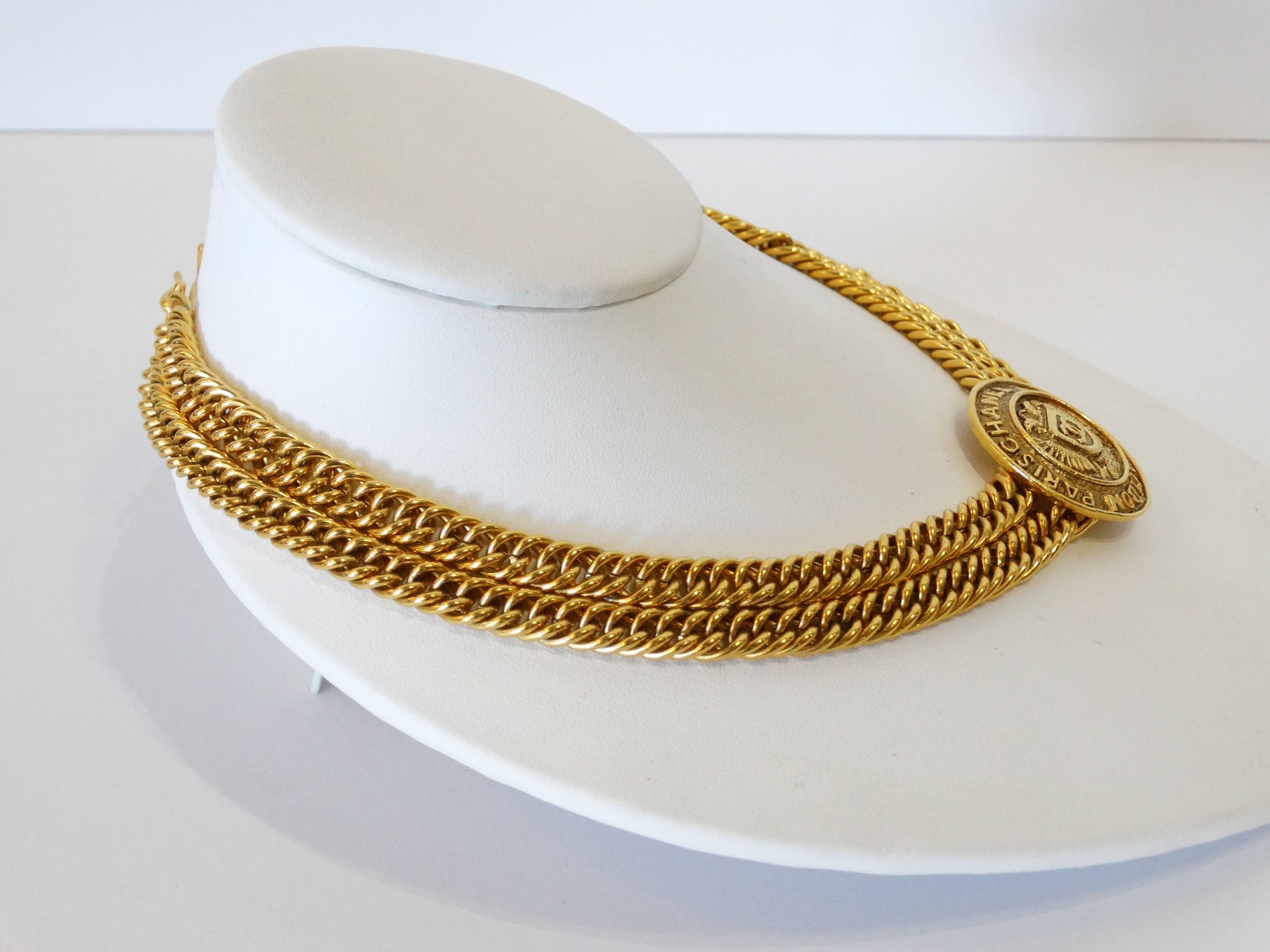 Incredible Chanel choker from the 1980s. Two thick chains with Medallion charm cast in a brilliant gold metal. Medallion boasts Crest encompassed with Paris Chanel 31 Rue Cambon Hook closure at the back of the neck. Signature on the back of the