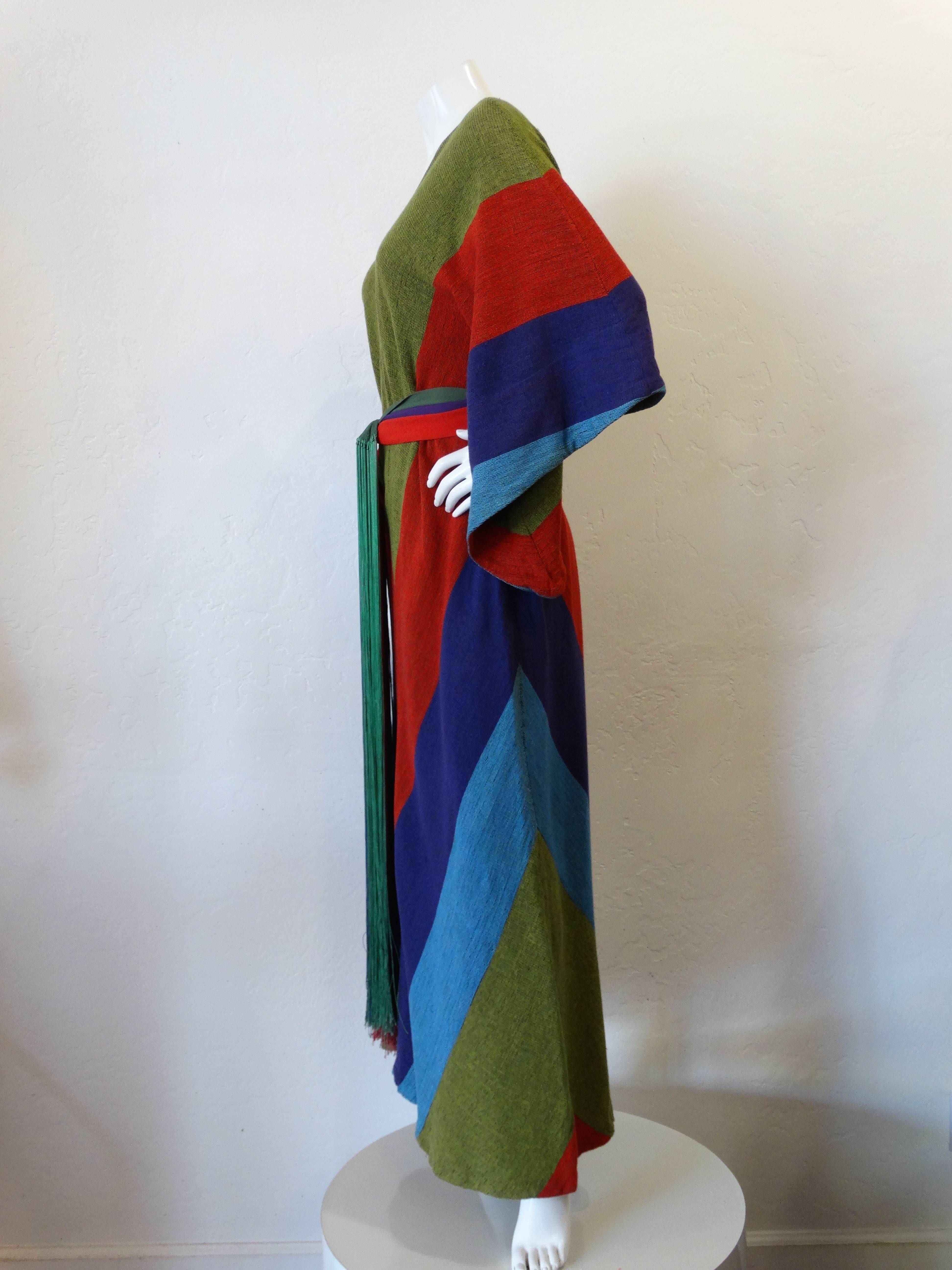 A beautiful dress by Rikma of Israel, large angel wing sleeves. Sweeping maxi length. Woven in 100% cotton. Comes with a fabulous floor length silk fringe belt. In red, purple and green. 
Measurements: Taken laying flat, please DOUBLE for exact