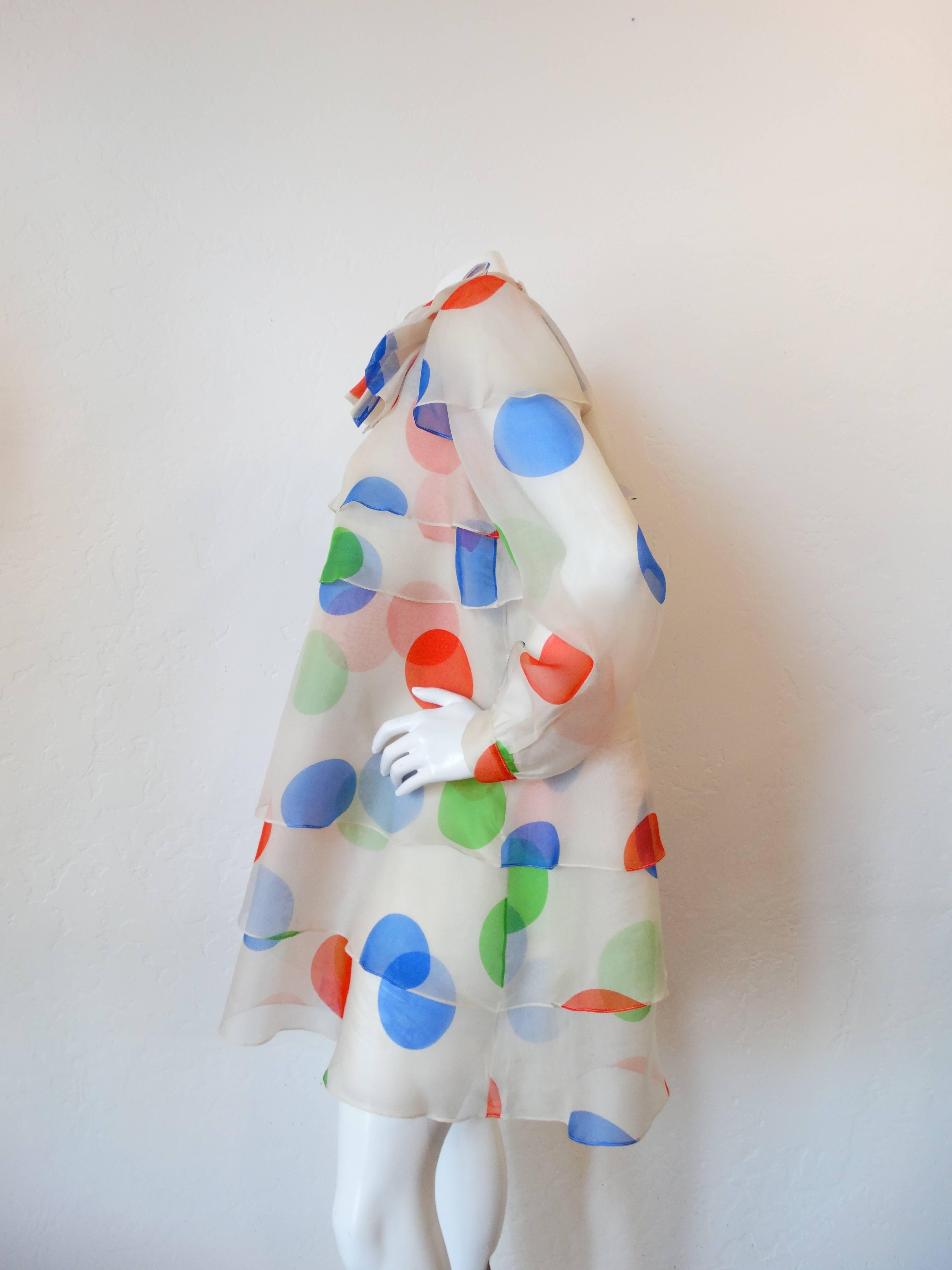We are OBSESSED with Fong Leng! Originating in Amsterdam- these vintage pieces are hard to come by! This dress is from Fong Leng's studio line- in a brilliant multicolored polkadot print. Light, sheer chiffon fabric layered to create the perfect