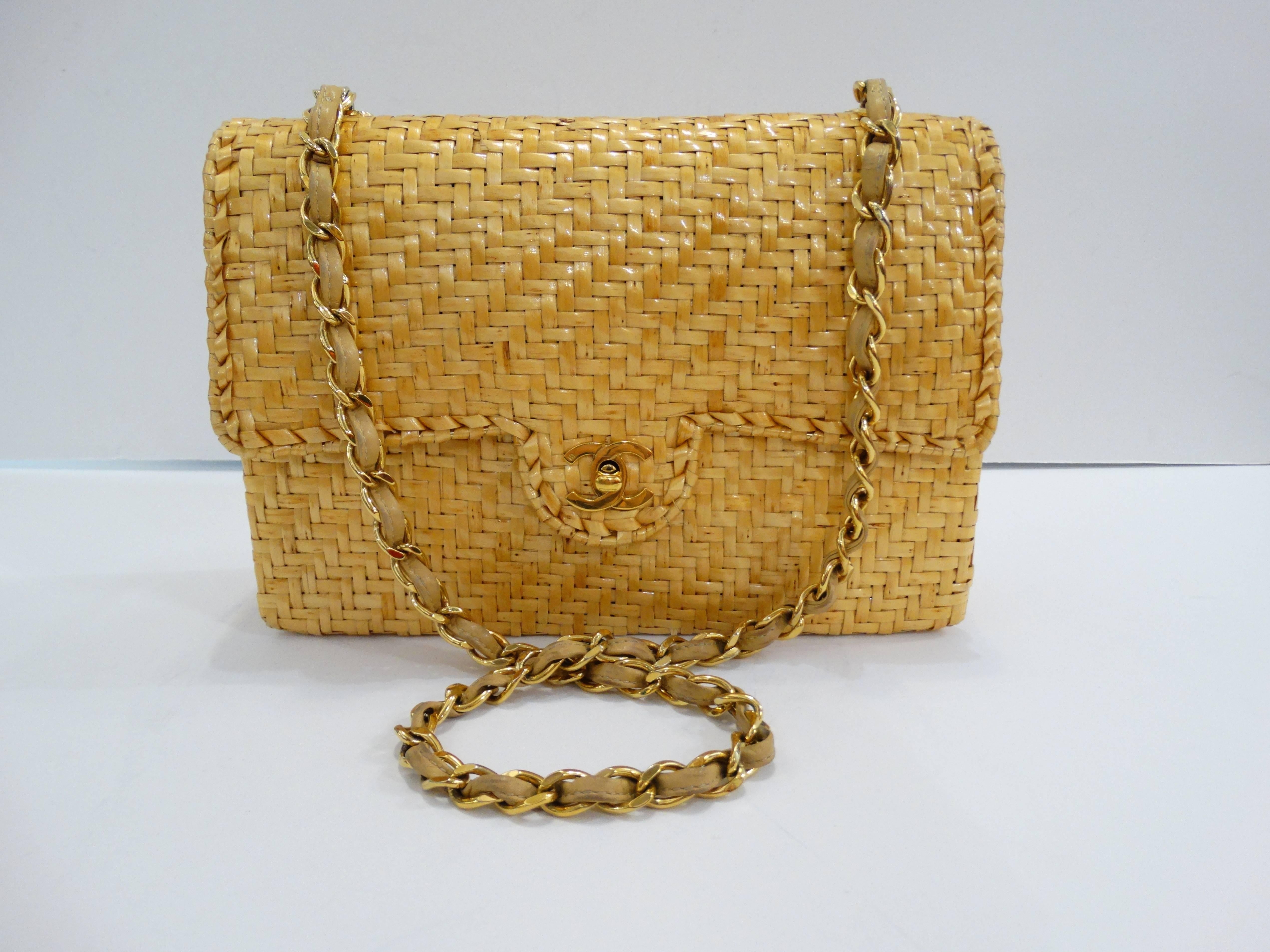Get in on the wicker bag trend with this amazing Chanel piece! Made of woven rattan wicker in the classic 2.55 rectangular shape with flap closure. Turn-key CC logo clasp in a brilliant gold metal that matches the chain. Fully lined cloth interior