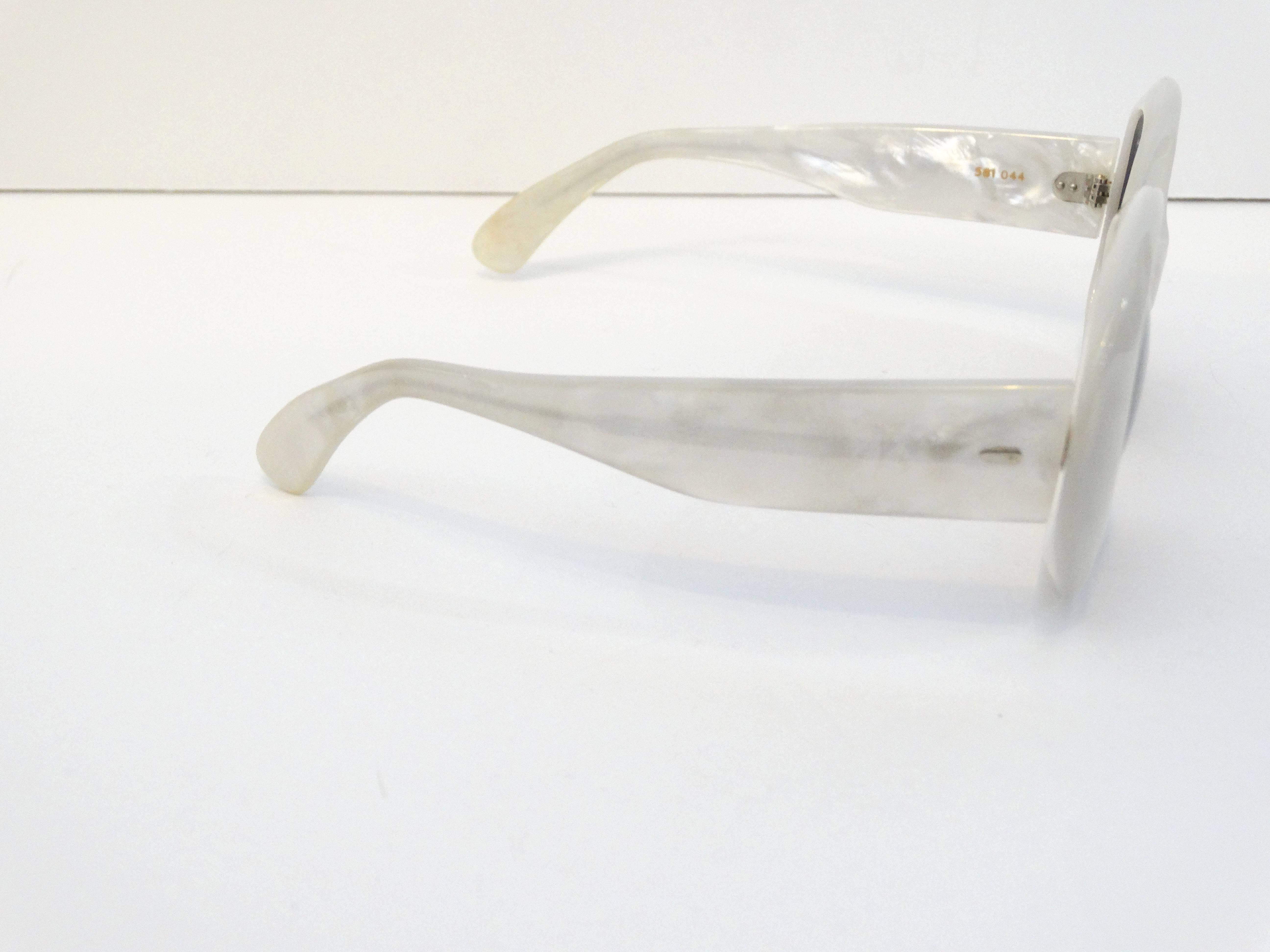 The '60s were truly revolutionary years that sent rockets and hemlines soaring. Launch your own lunar look with these 1960's Claude Montana Mod Mother of Pearl White Sunglasses. All eyes will be on you when you're sporting these specs in the