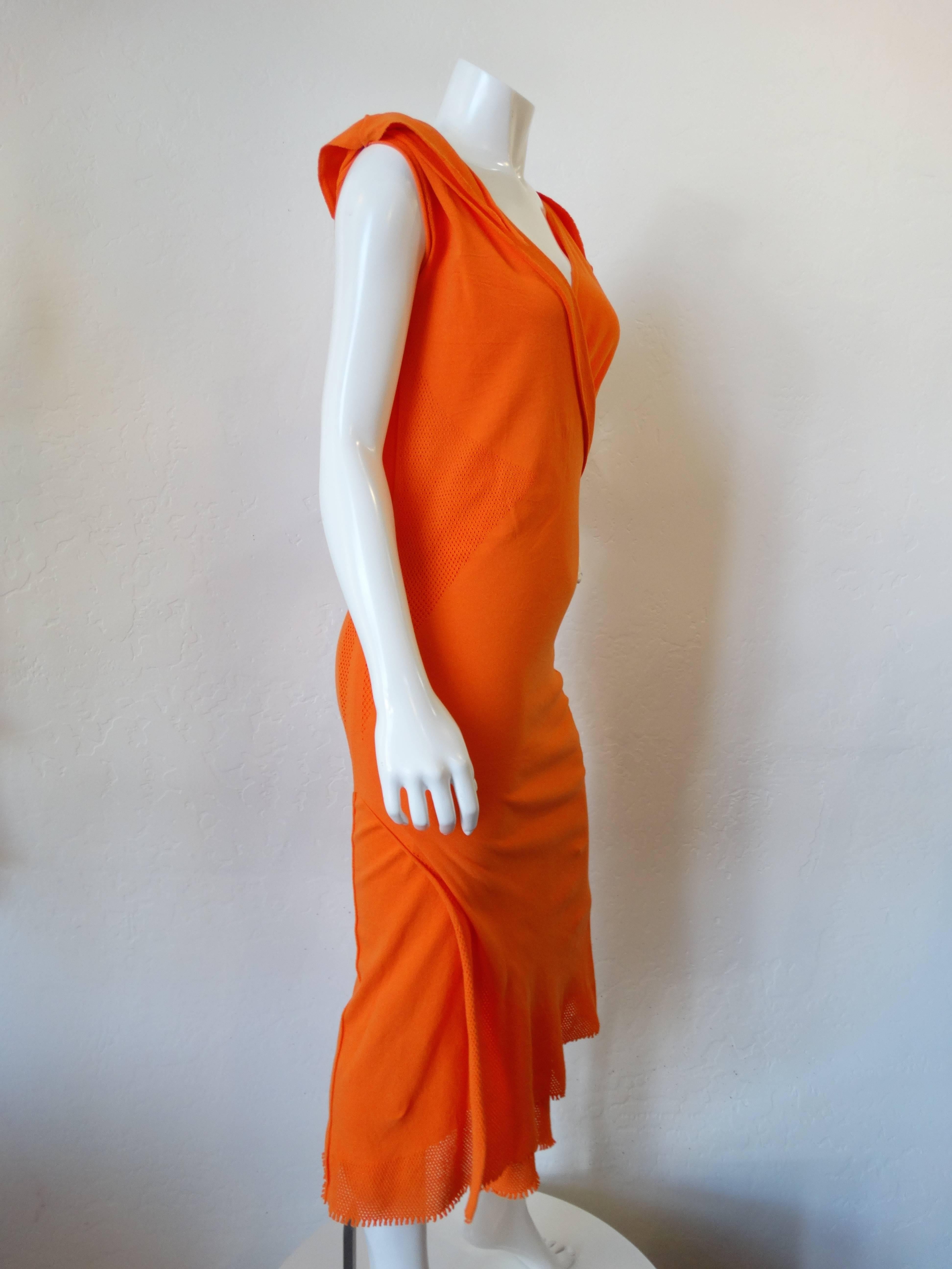 Fabulous 2005 A-POC BY ISSEY MIYAKE AND DAI FUJIWARA in a brilliant orange. 2 pieces of fabric layered over one and other. Miyake “A-POC” is an acronym for “A Piece of Cloth” and refers too, to the idea of “epoch.” It is a manufacturing method that