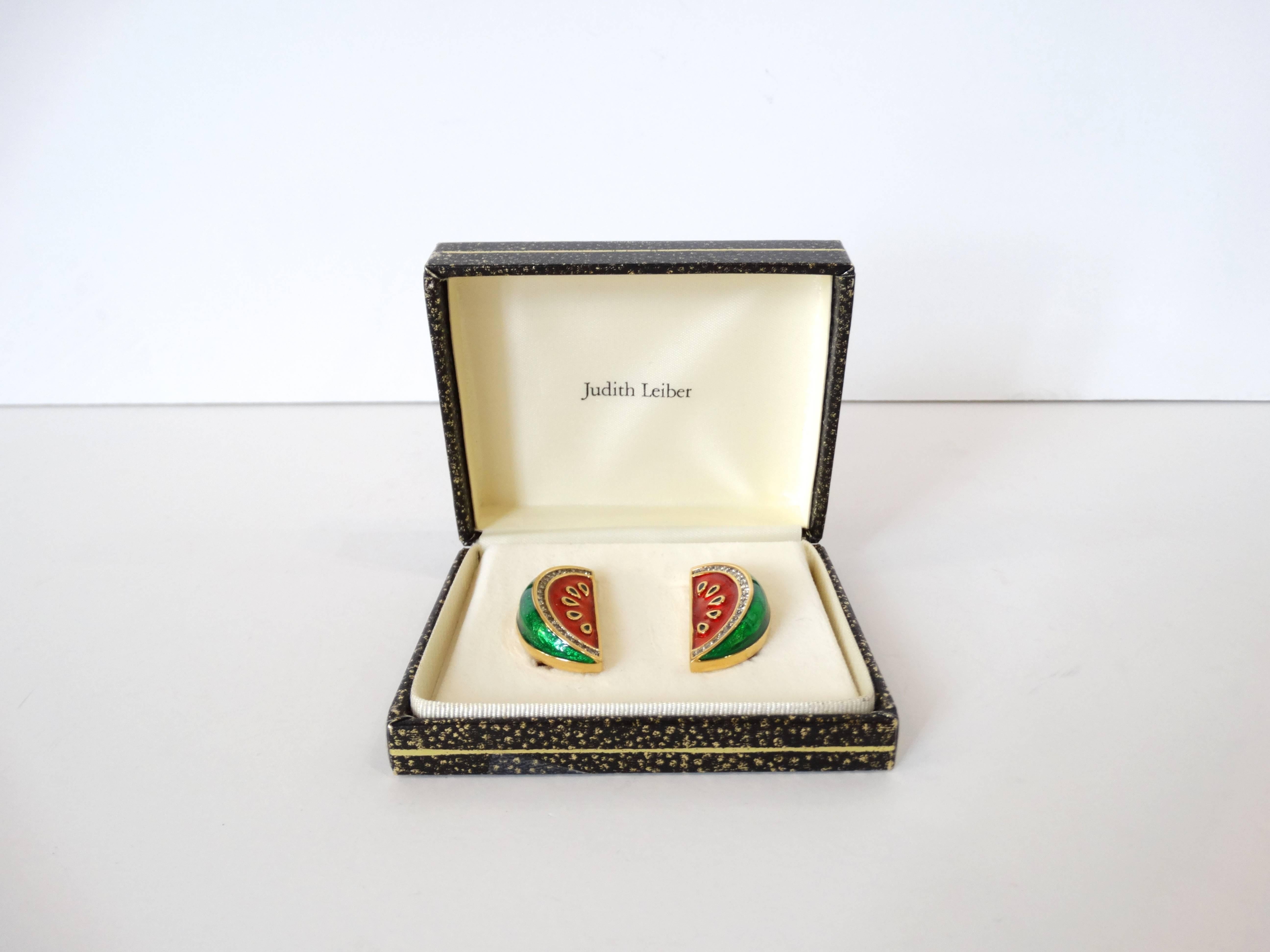 Adorable pair of Judith Leiber watermelon earrings! Gold metal with red and green enamel- accented with crystals along the rind. Clip on backs. Signed at the back. Comes with original box. 