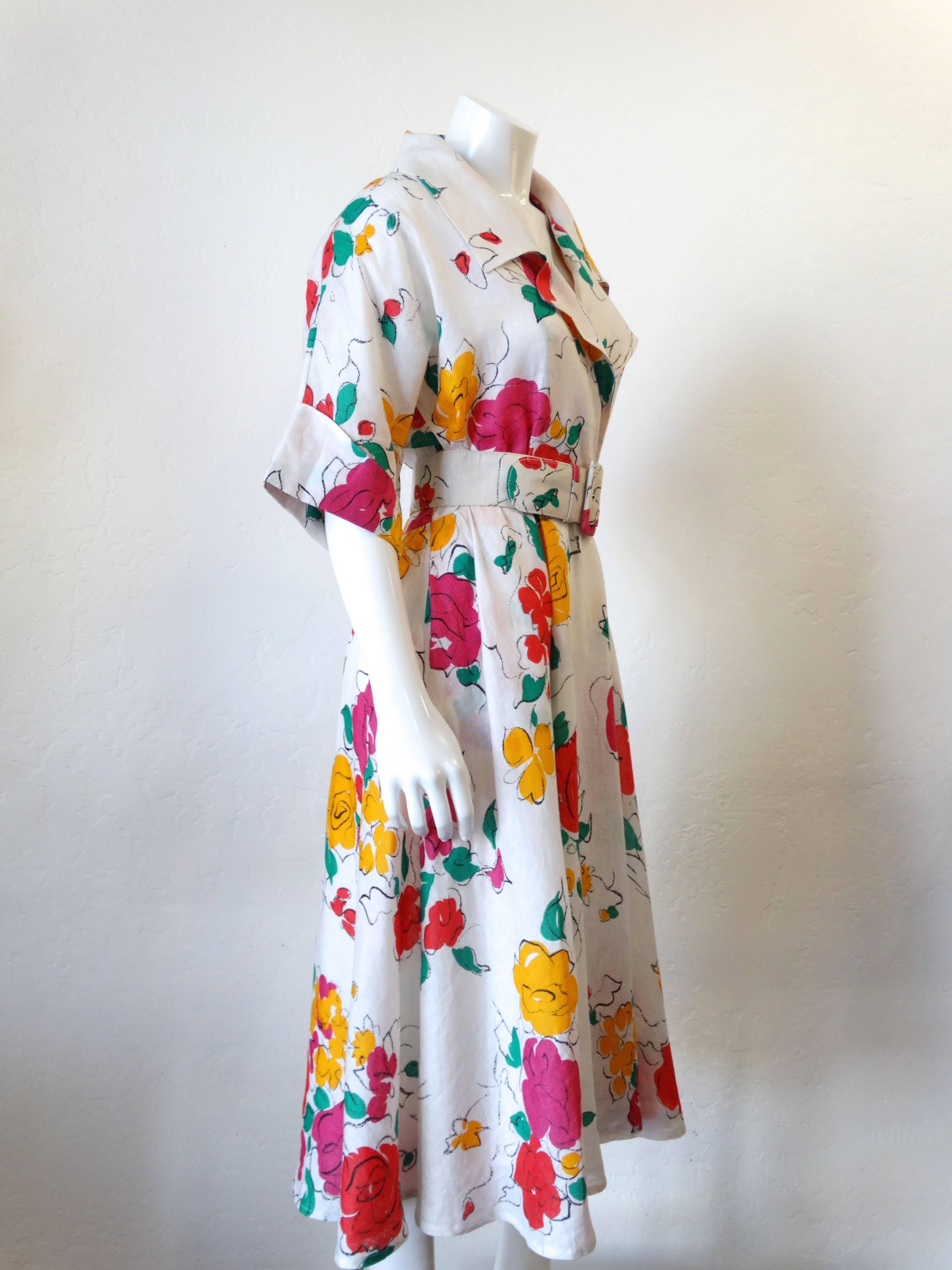 Beautiful 1986 GUCCI Linen Floral Dress with yellow, red and pink roses and green leaves on a white linen background. SIZE 42 (8 US) Tea Length with a full skirt. Matching linen belt. Shawl collar with quarter length sleeves, thin attached shoulder