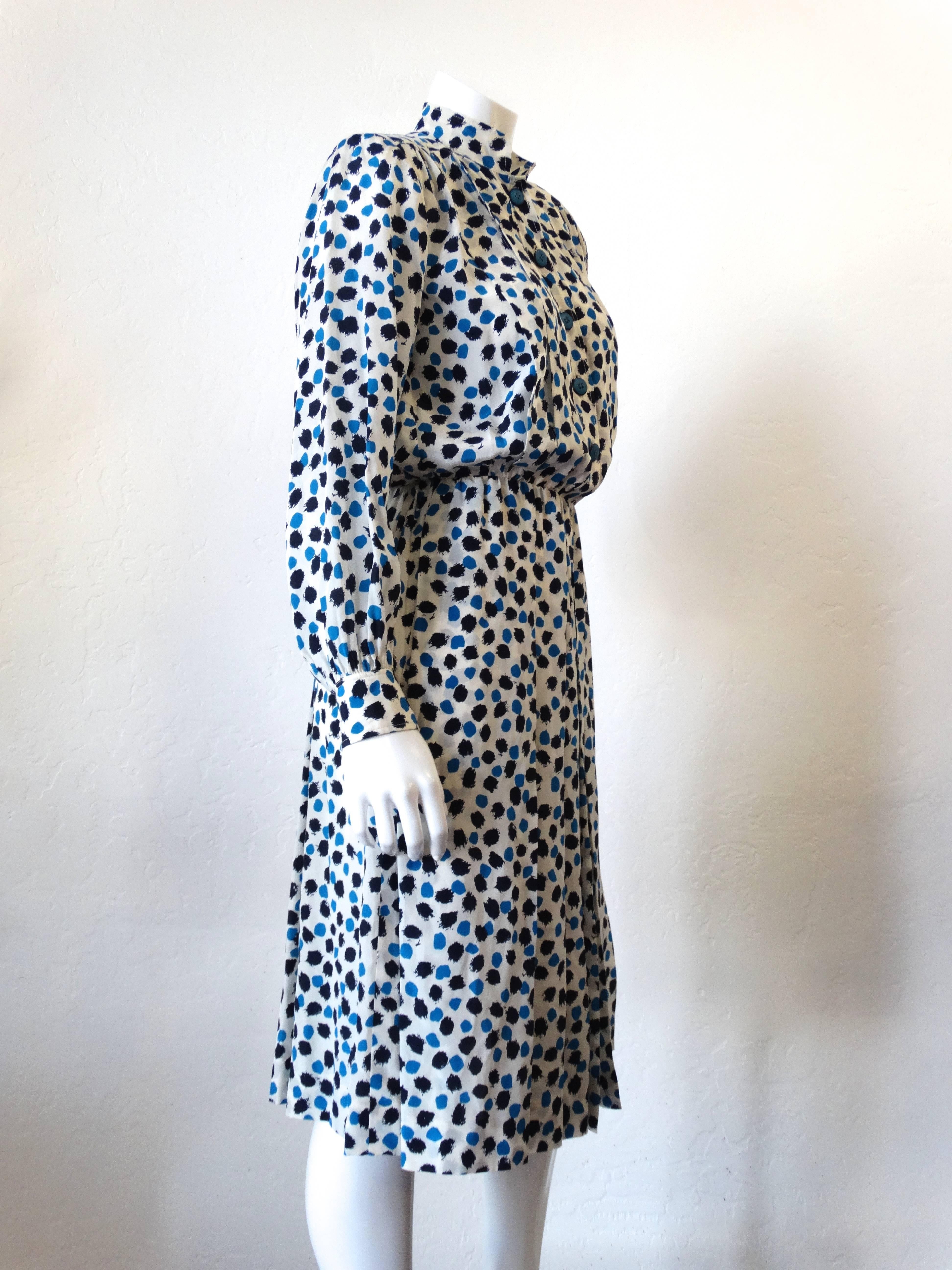 Vintage Yves Saint Laurent knee length silk secretary dress featuring an allover dot print, front button placket at the bodice, and a side zip entrance. Circa 1984, Made in France (Belt not included it is listed in my shop) Marked size 36