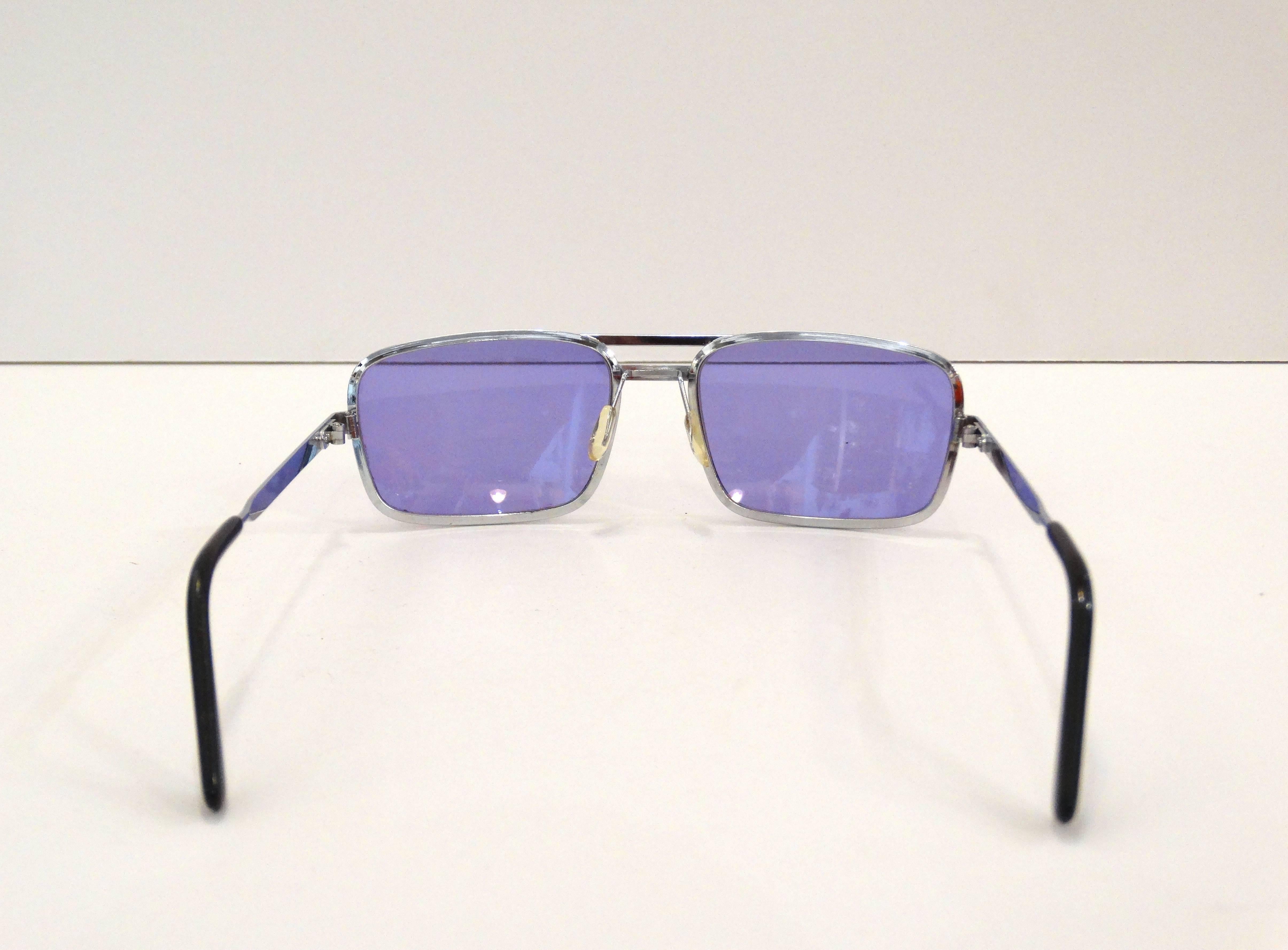 Rock the colored sunglasses trend with these sexy 1990s rectangular lenses in a brilliant violet! Quality silver metal frames, brand unknown. Marked Made in France 