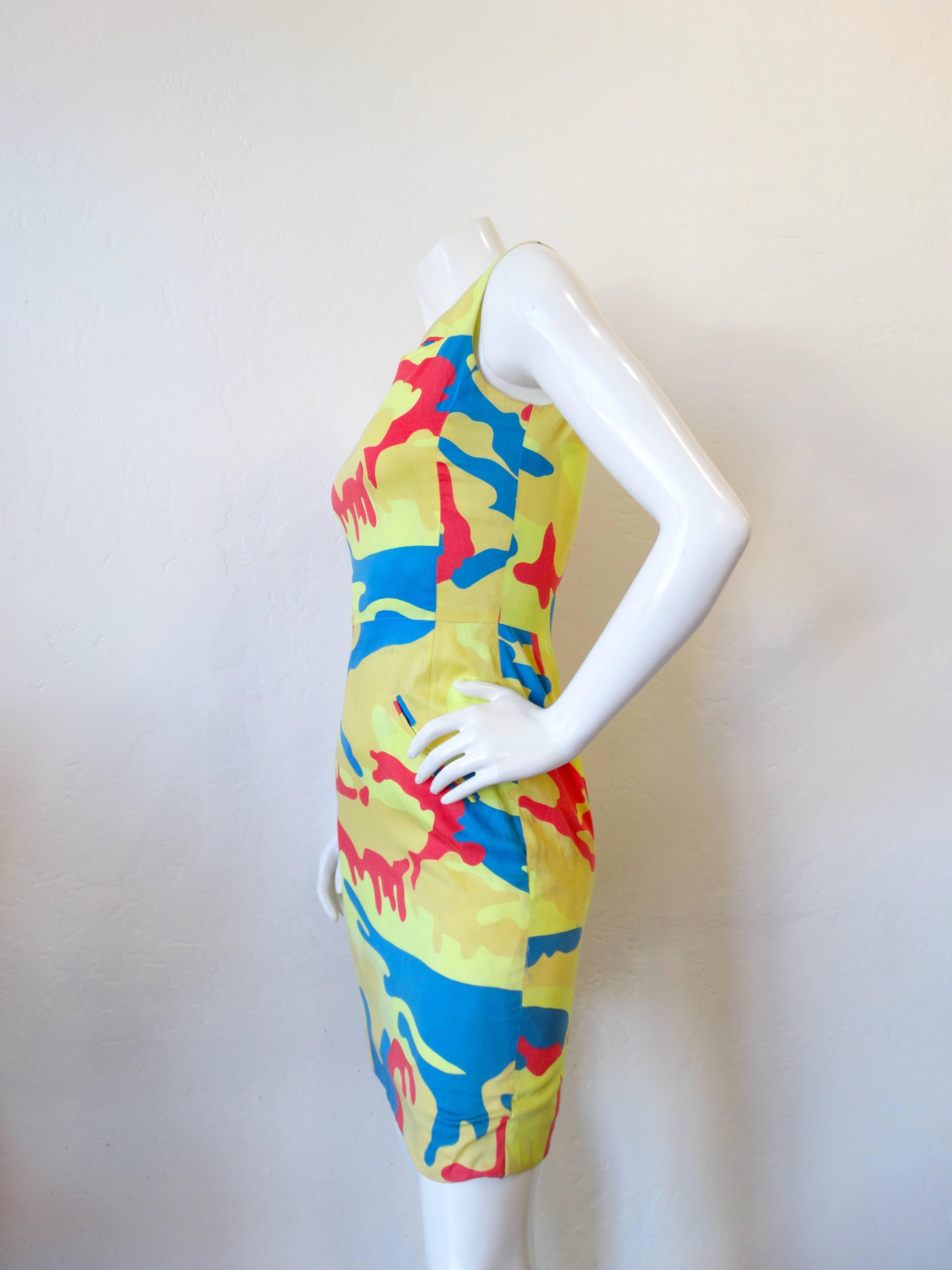 This piece was created in 1987 through a collaboration between iconic Pop artist Andy Warhol and eccentric designer Stephen Sprouse. These pieces are wearable art- the primary colored camouflage print designed by Warhol himself. Body con silhouette