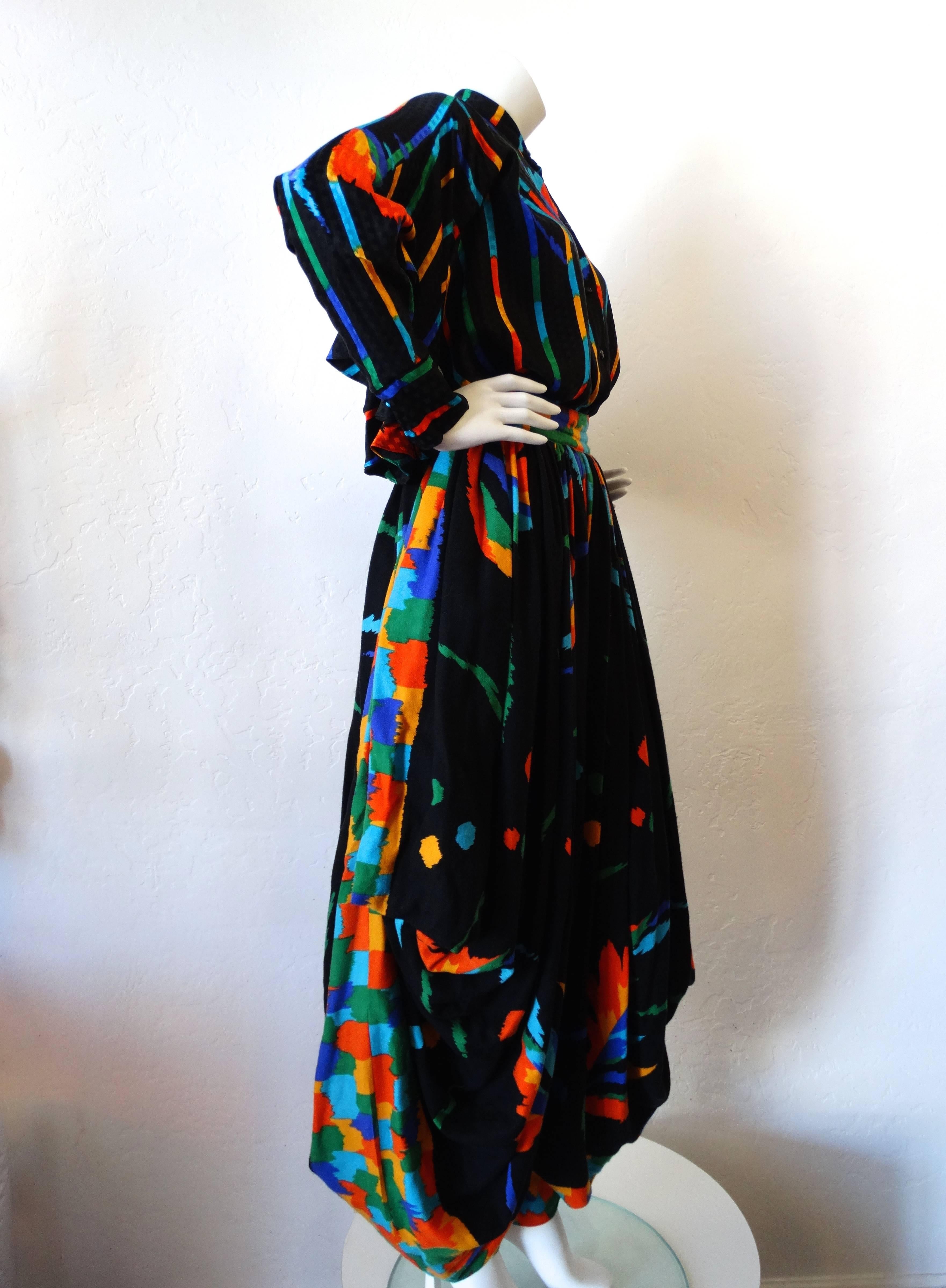 Incredibly rare set from Amsterdam designer Fong Leng! Black and rainbow print featuring stripes, feather motifs and brush strokes. Top buttons up the front- features a high neckline and dramatic fluttering sleeves. Pants sit high waisted, with