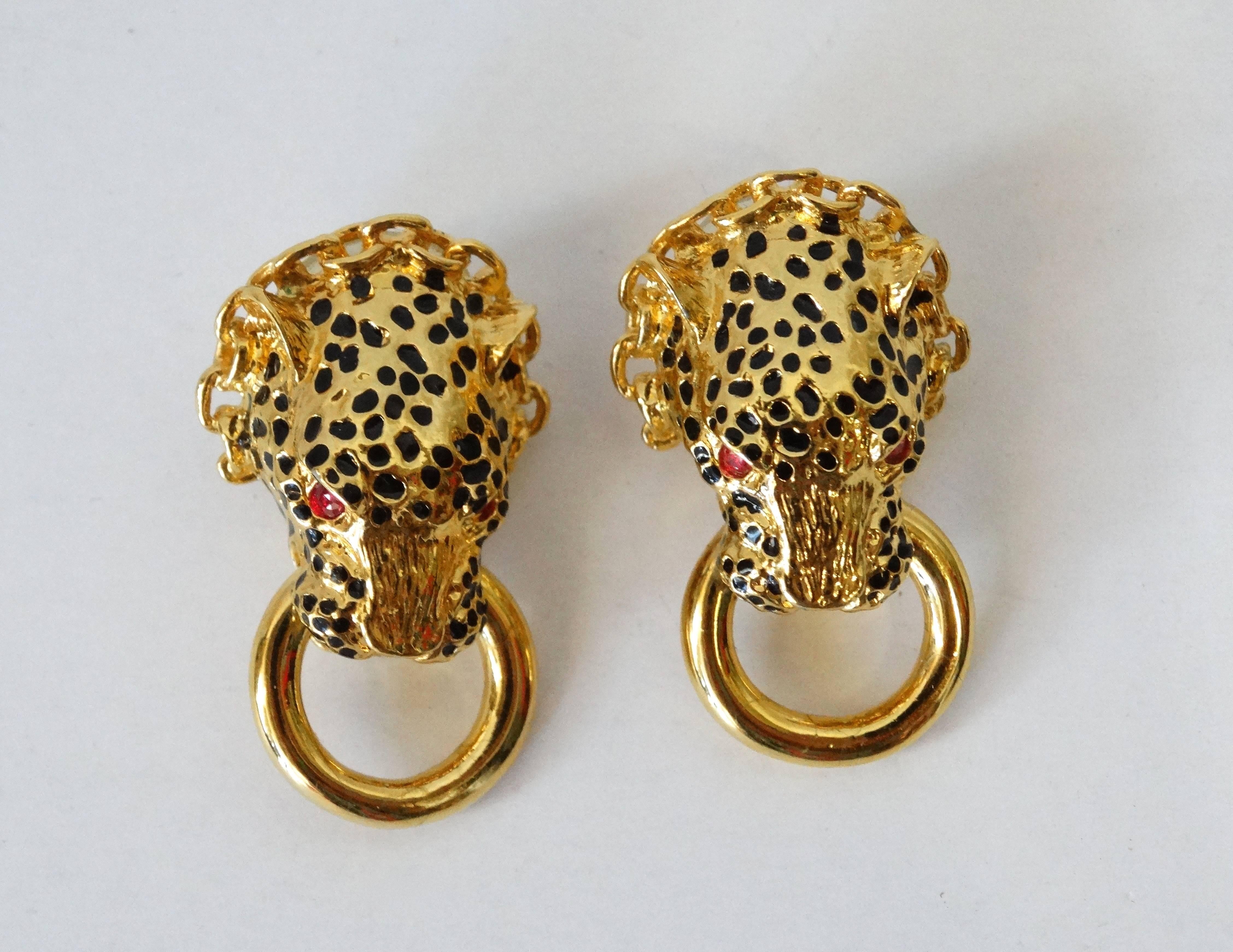 A fabulous pair of 1980's Franklin Mint The Duchess Of Windsor Panther pierced earring with ruby rhinestone eyes. Signed Circa 89 FM on the inside by the pierced post. Plated gold, with Black enamel spots. 1.5 inches long! Matching Bracelet and