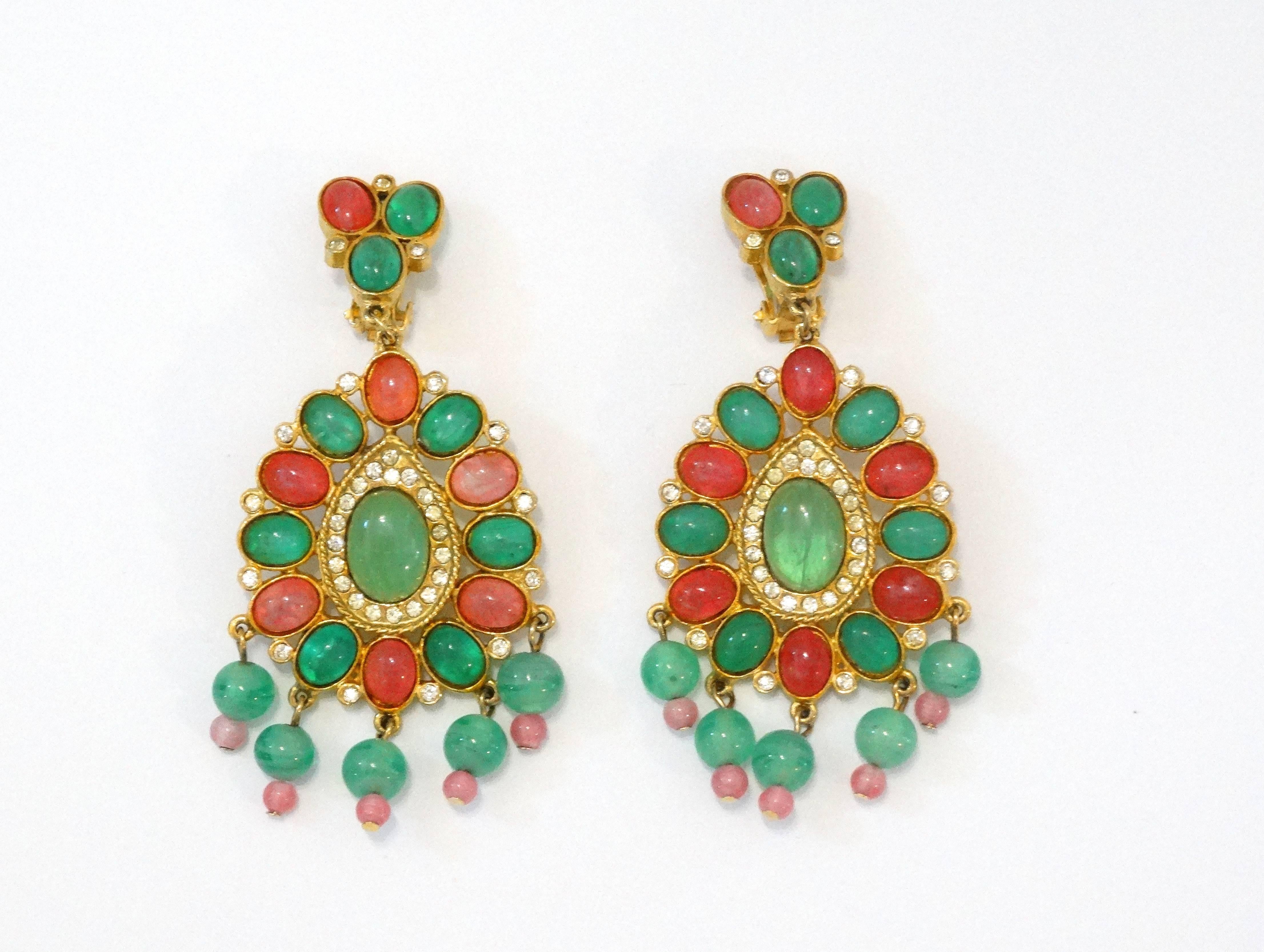 Incredible pair of 1960s chandelier style earrings! Pink and green glass beads and gems accented with crystalline rhinestones. Plated in 18k gold. Clip on backs. These earrings where purchased from Magdolna 