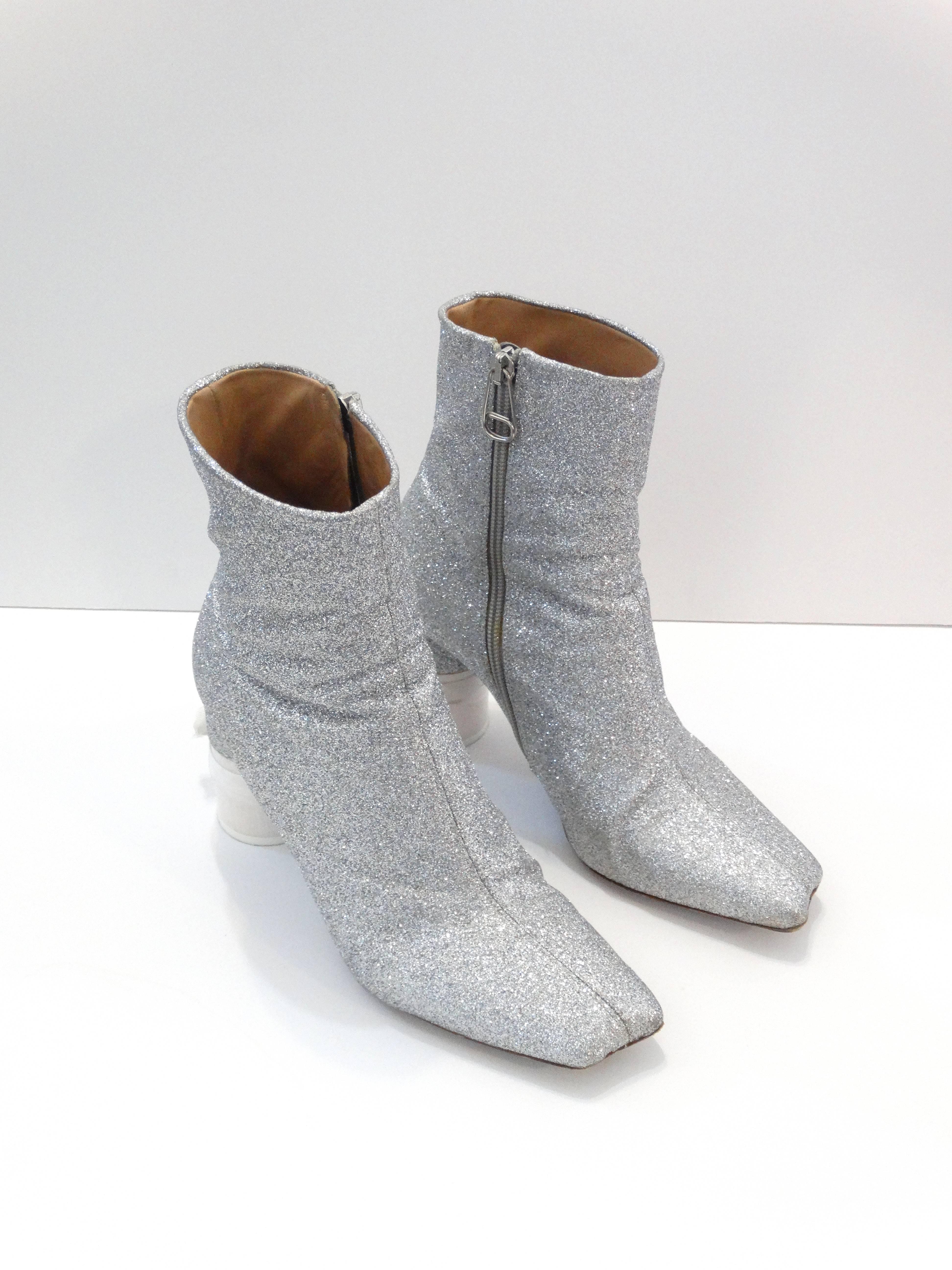 A fabulous pair Martin Margiela silver glitter ribbon heeled booties. Marked size 38.5 fits a todays size 8. Comes with a brand new package of ribbon for the heels. In original box 