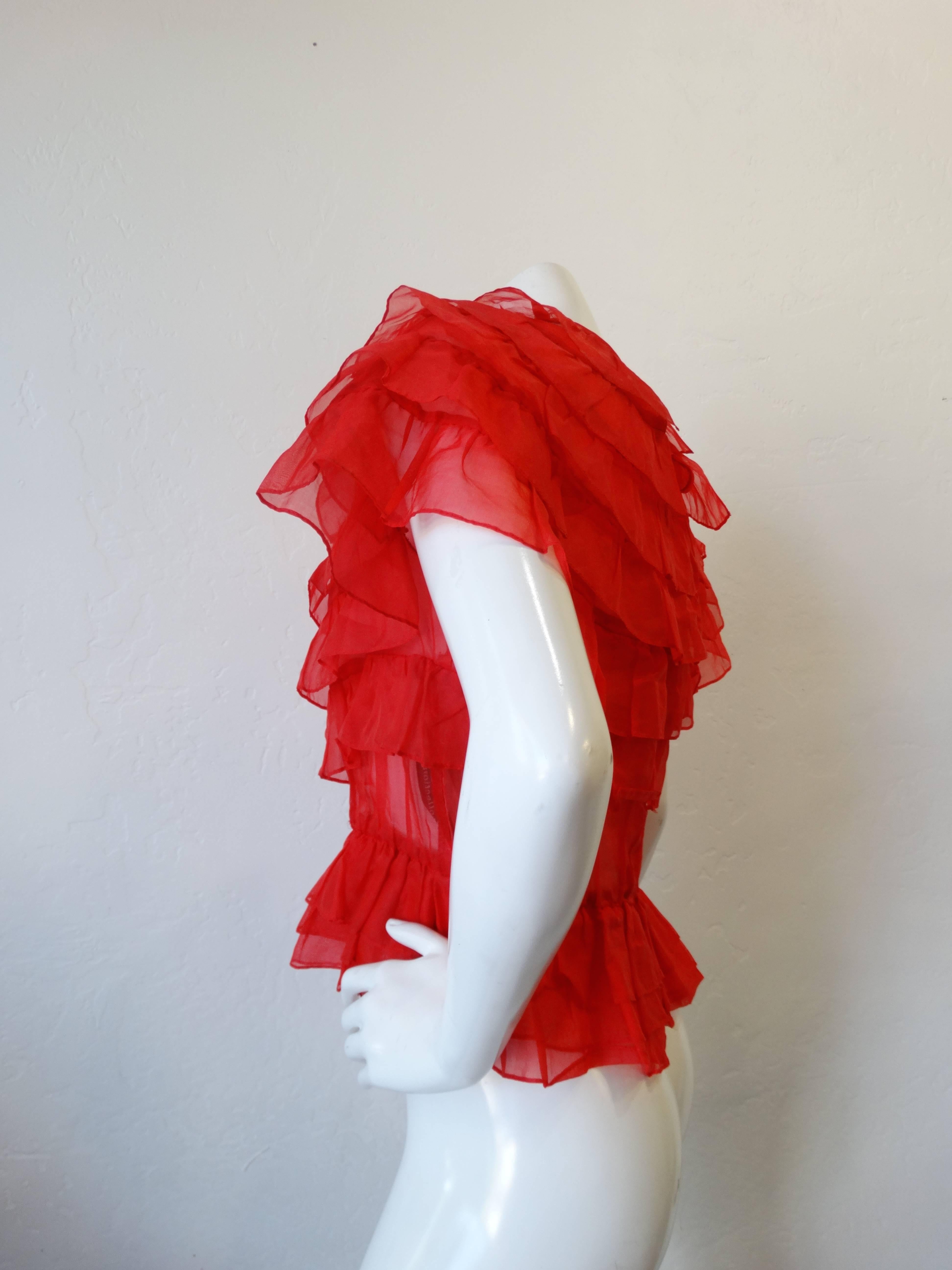 FABULOUS vintage ruffled blouse, from Joy Stevens Collection! Fabric is sheer lipstick red. Style features layers of ruffles, ruffles cap over shoulder, vintage button keyhole at back of neck, elastic waist-elastic does not have much stretch.