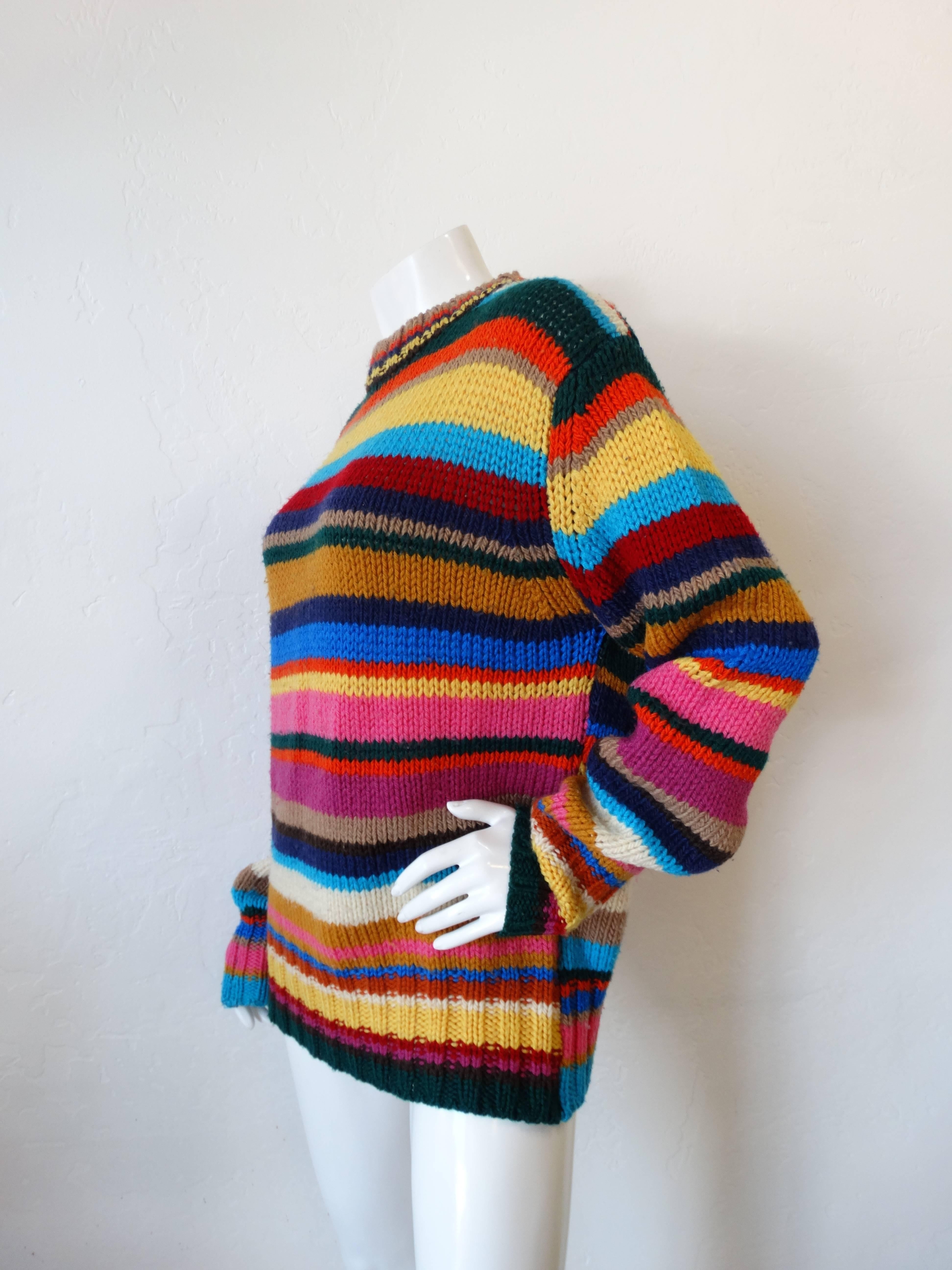 Dolce & Gabanna sweater is knitted with acrylic and pure virgin laine (wool) creating a sumptuous contrast of textures. The retro-inspired red, yellow, turquoise and pink stripes call to mind the style maven's love of vintage and pieces worn by