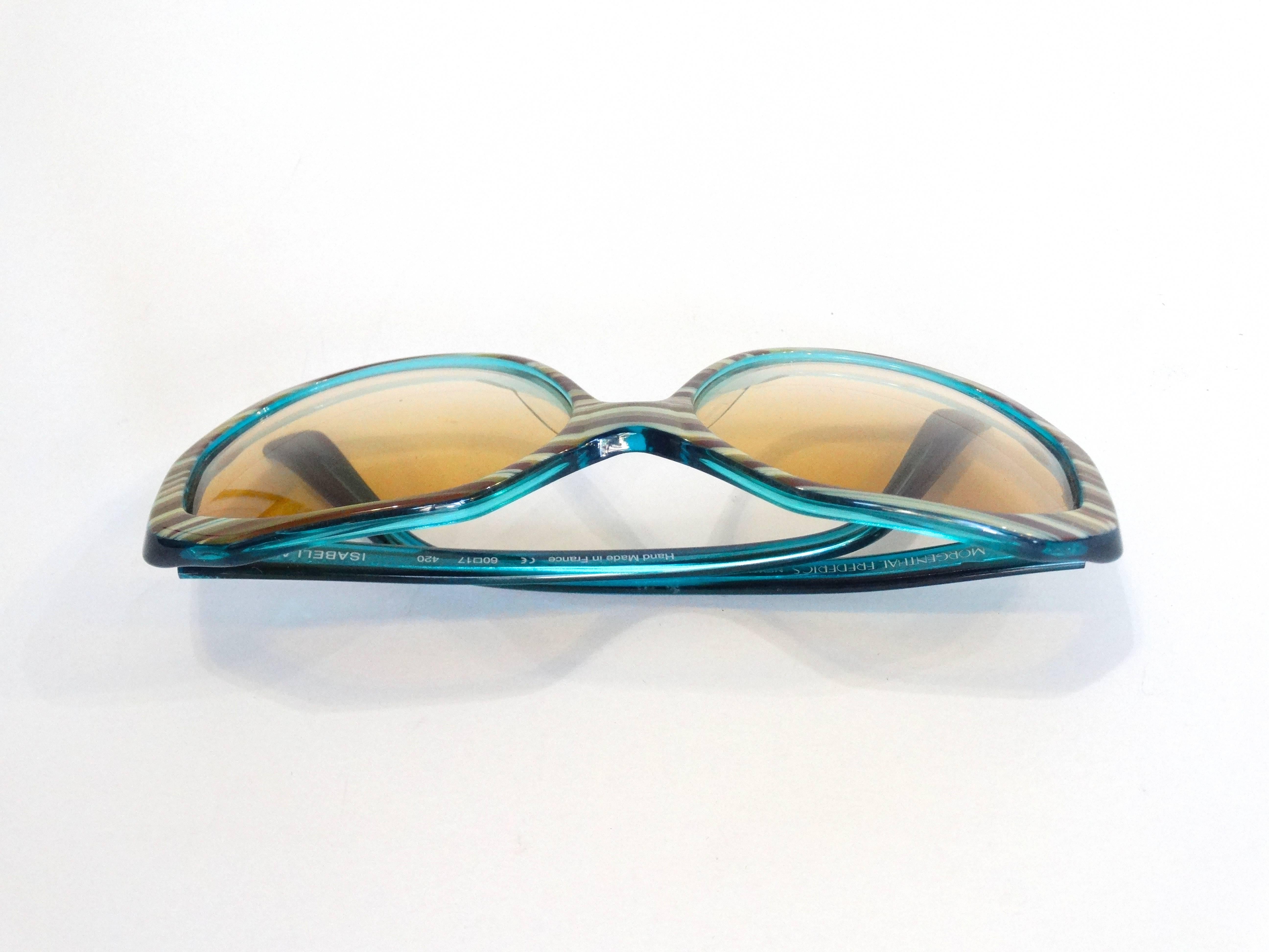 1970s inspired sunglasses from Morgenthal Frederics! Trendy yellow tinted ombre lenses. Brown and tan wood grain striped design with teal trim! Handmade in France.  Total Length 6 inches 