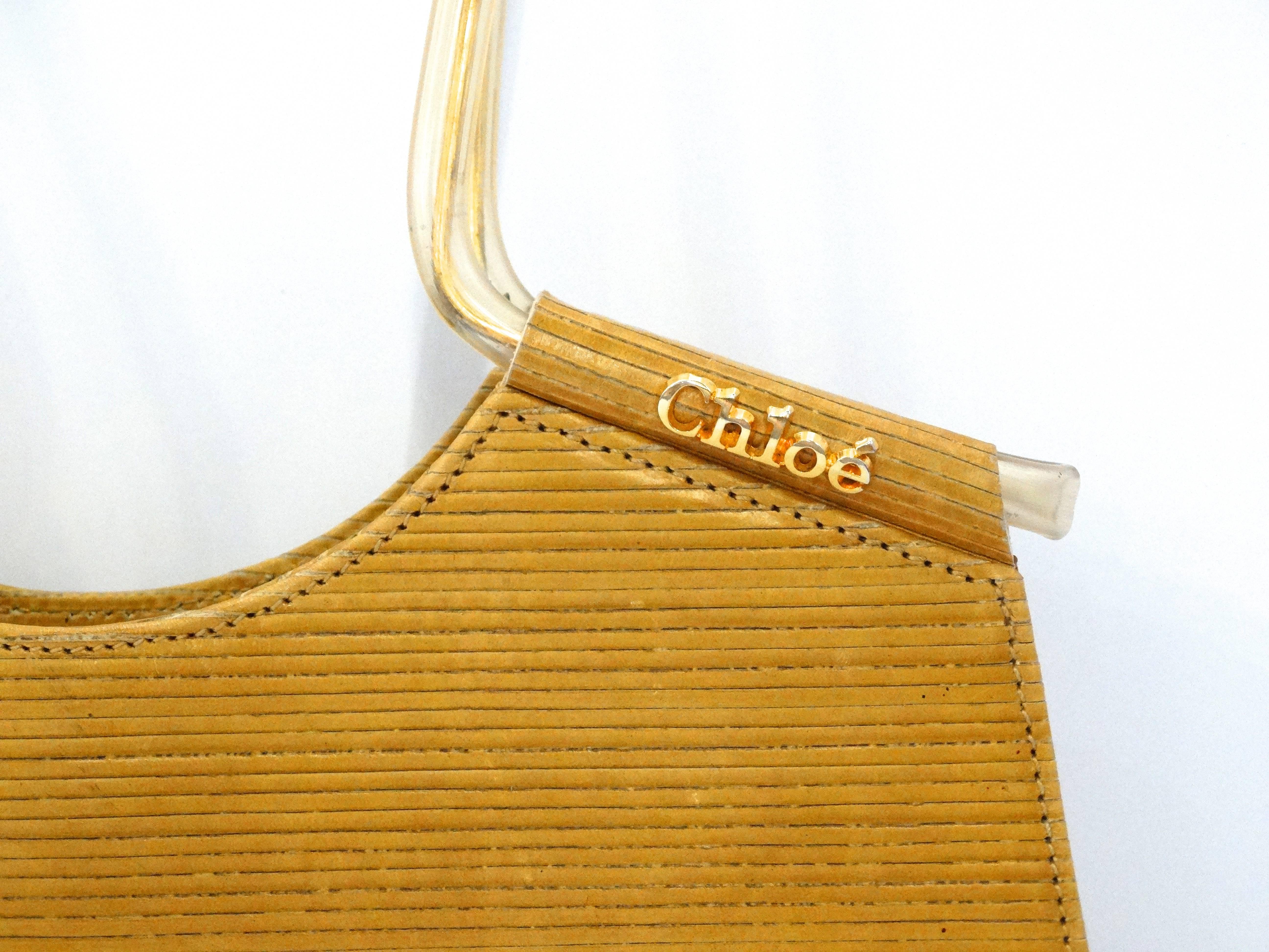 This wonderful Chloe from the 1970’s is the epitome of legendary style. Very rare top handle handbag in epi-like leather with very cool handles.  You will never have a chance like this again to obtain a piece of fashion history designed by Karl