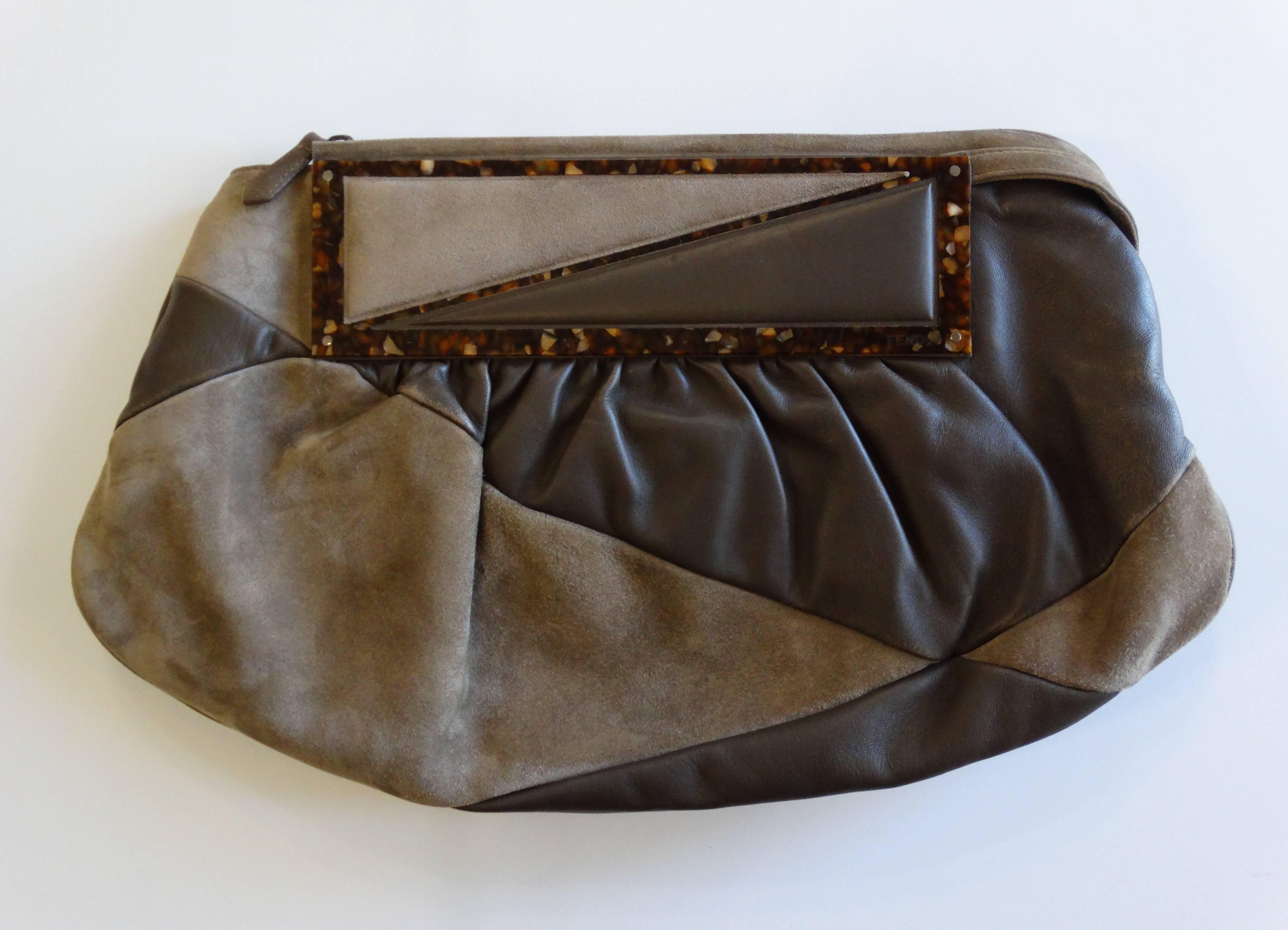 Incredible late 90's Fendi Borsa Pochette to You bag! Hobo style with loose construction and top handle for easy carrying. Zips open at the top to reveal fully lined cloth interior and zipper pocket. Made of a soft buttery tan suede and rich brown