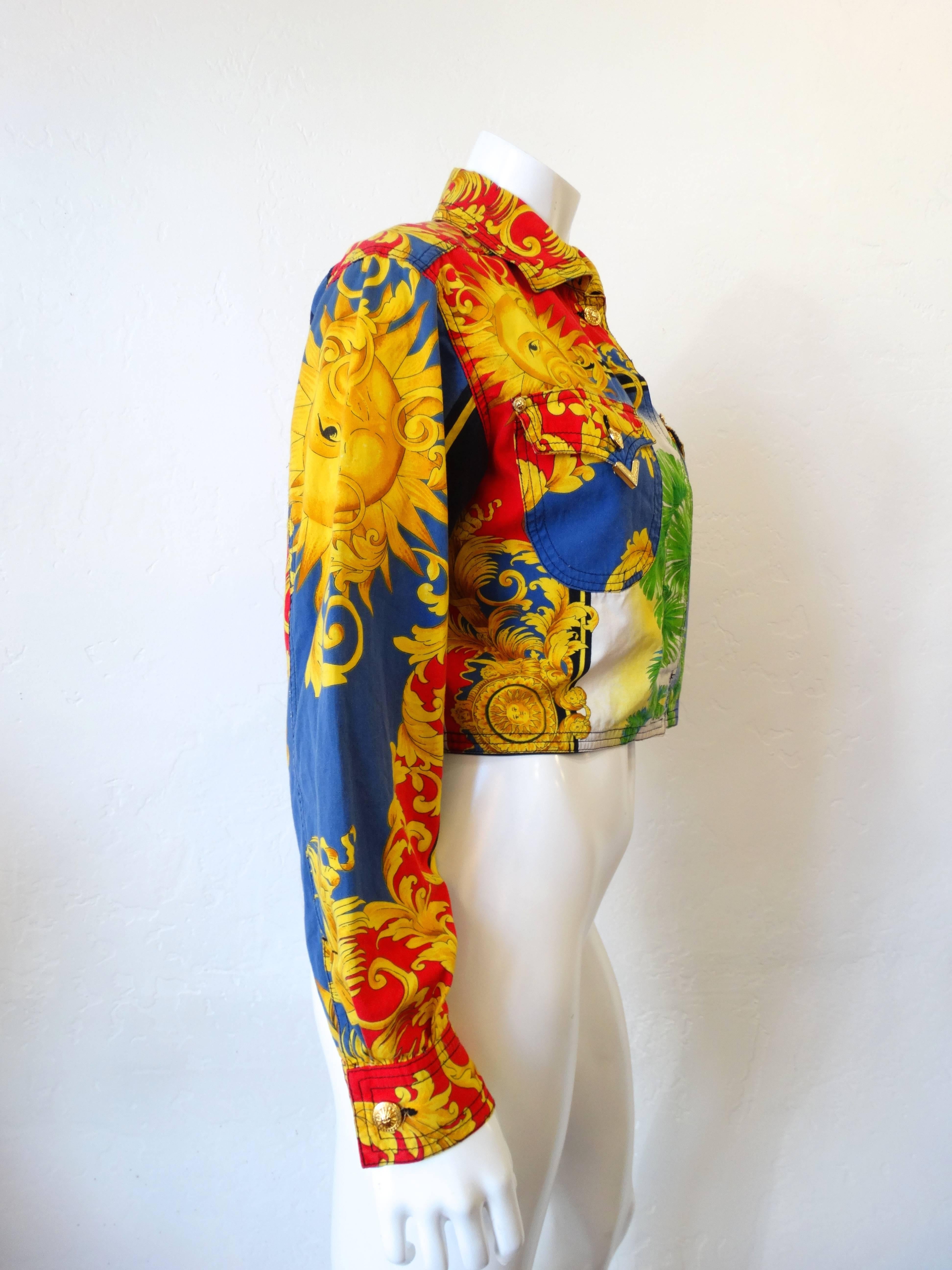 Iconic Multi-coloured cotton sun baroque print jacket from Versace circa 1993 featuring a classic collar, long sleeves, button cuffs, a top button, a concealed front fastening, two chest pockets and a cropped length. Miami print..

Italian fashion