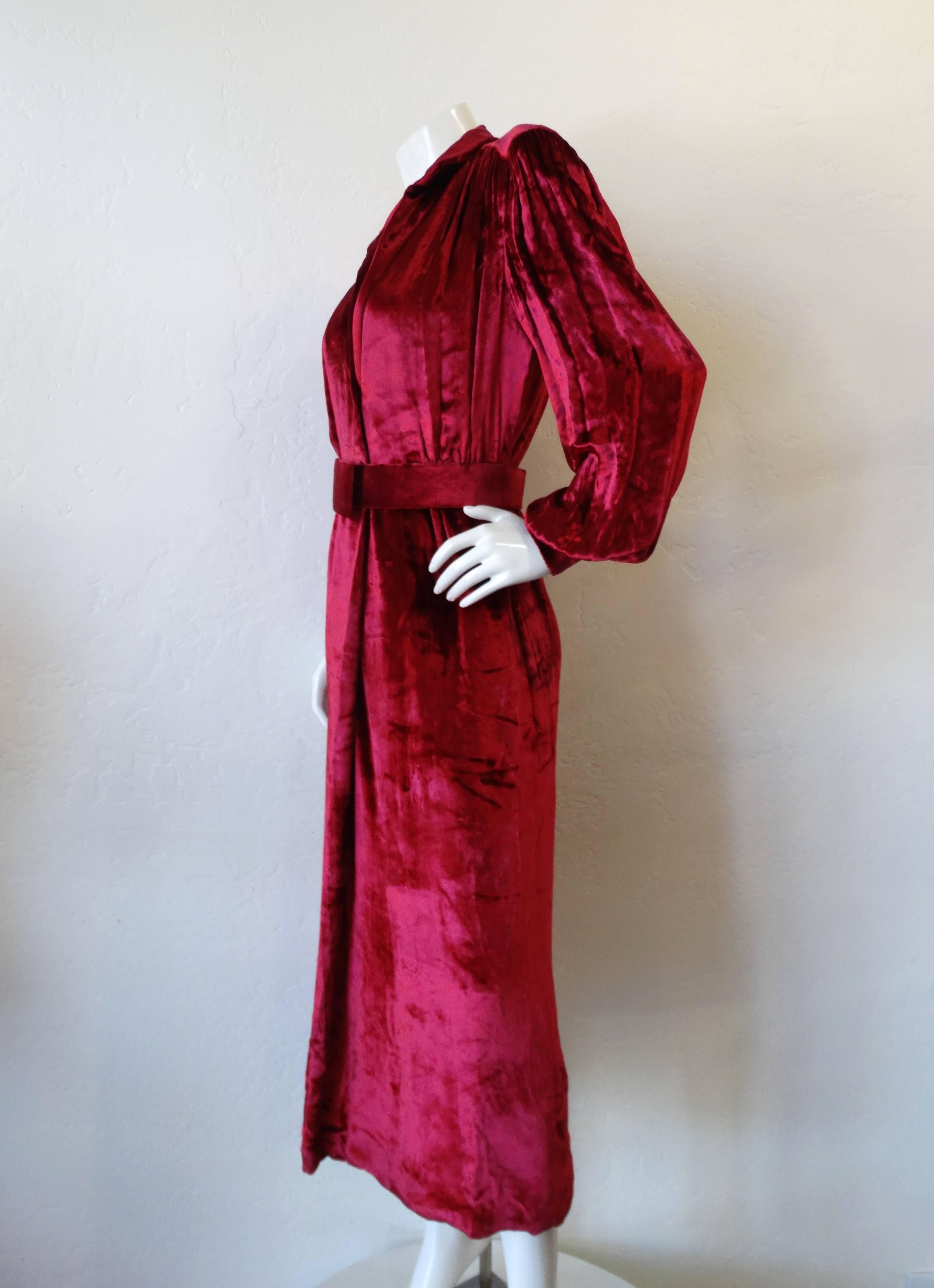 This is an absolutely stunning vintage dress from William Travilla from the 1980's! This incredible Boudreaux velvet dress has a deep v neckline, with detachable velvet belt to finish the look. The dress has a back slit and is such a great piece to