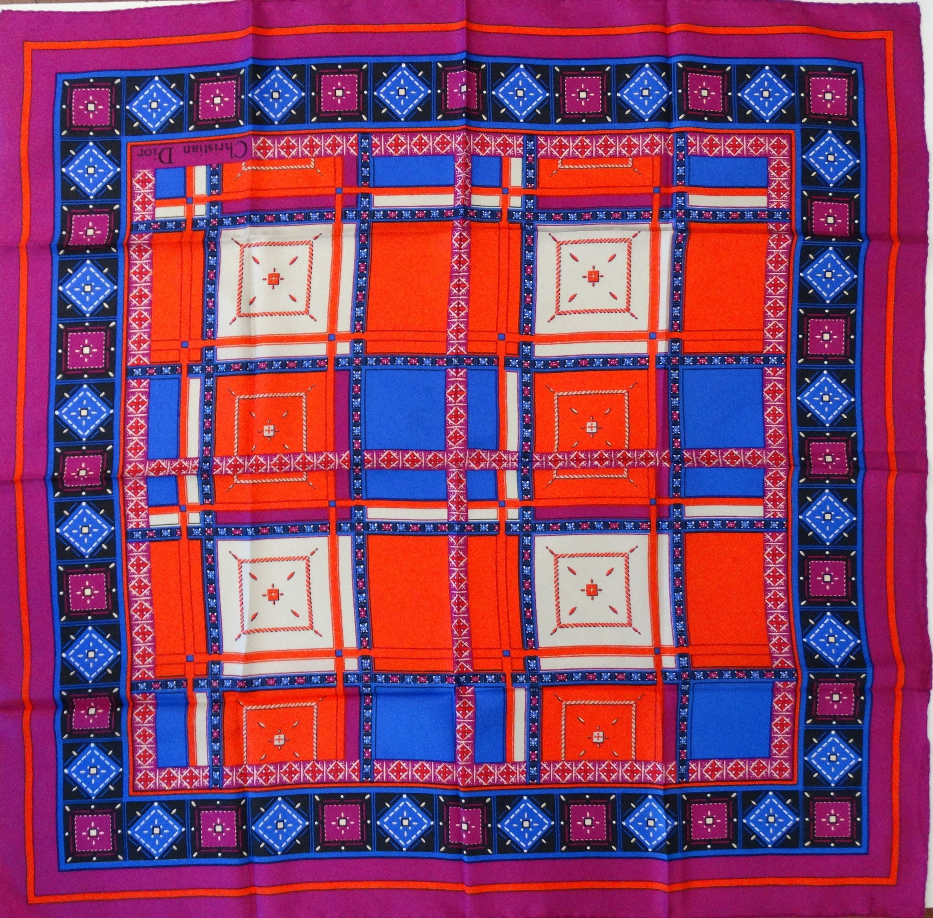 Gorgeous 1980s Christian Dior geometric jewel printed scarf! Printed in hues of magenta, blue, white and red- this piece makes a statement! This scarf is versatile with a capital V! Wear as a headscarf, tied on your bag, as an ascot- you choose! 

H