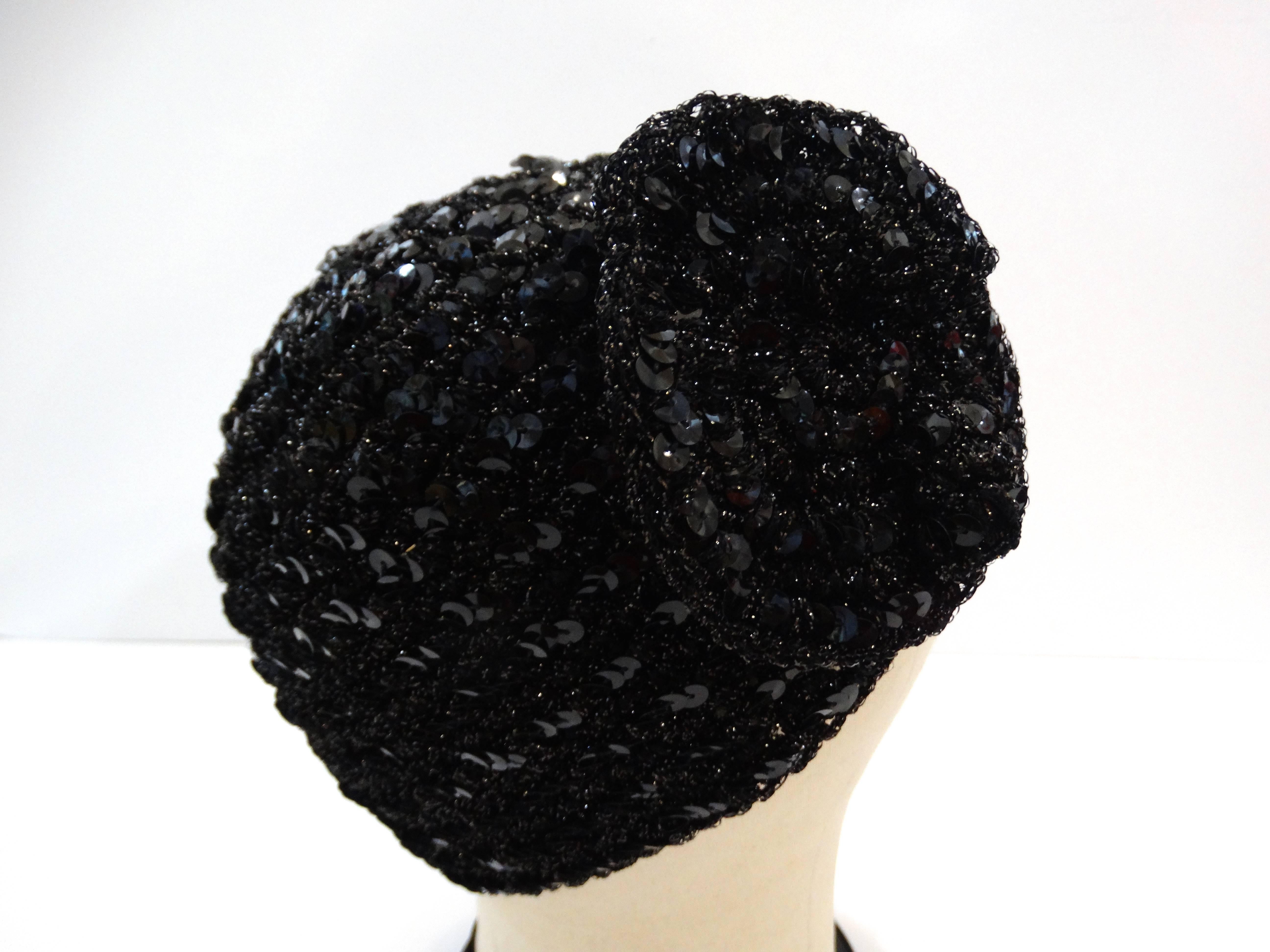 Super cute vintage Saks Fifth Avenue skullcap beanie! Black stretch knit accented with tons of sequins! Large sequined flower on the center of the hat. Sits comfortably on the back of the head, wears easily as a skullcap or a beanie. Fabric has some