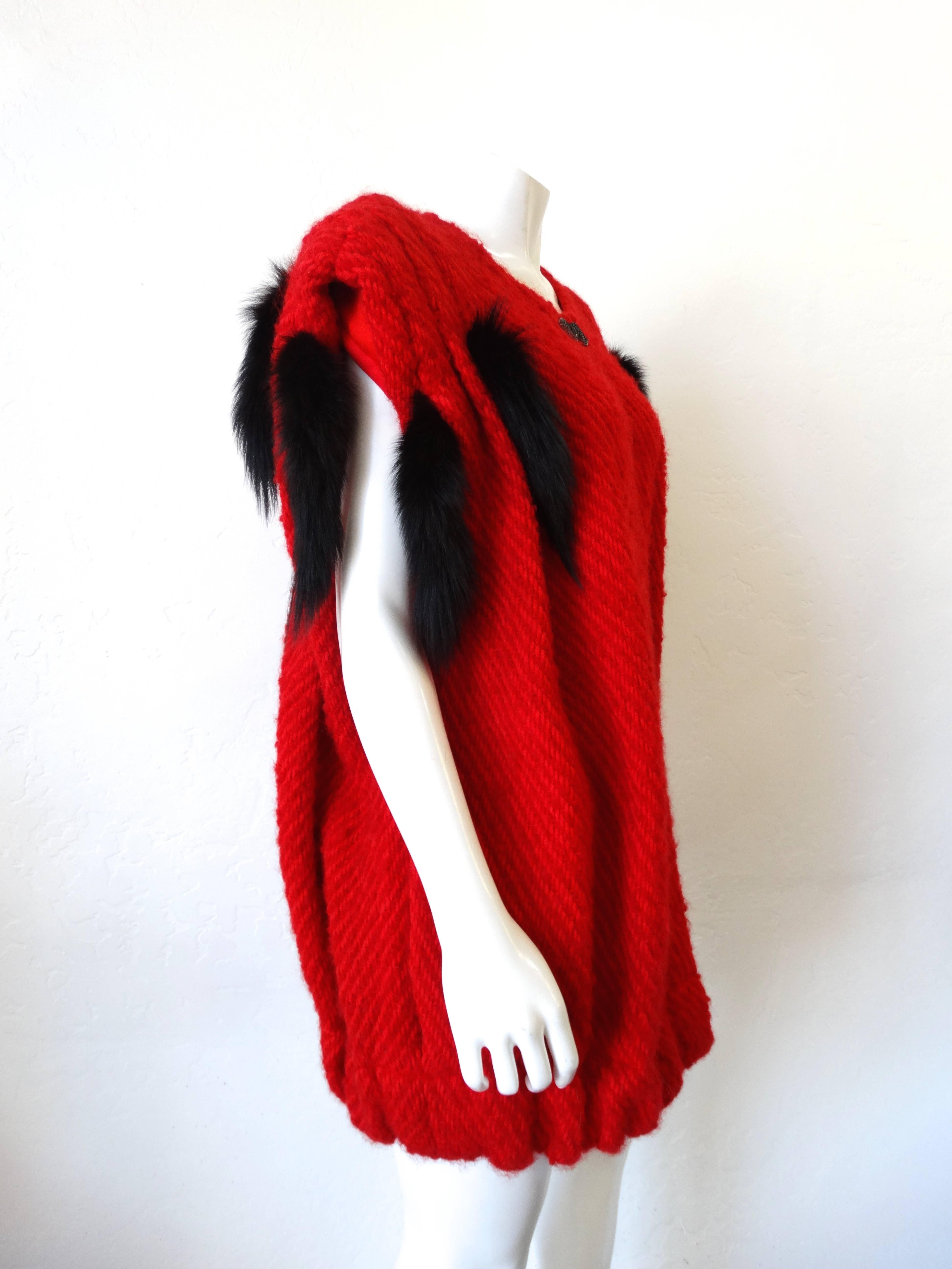 Get avant-garde this season with our incredible mink tail vest from Silver Lining! Super cool oversized silhouette with pleat-like construction. Bright red knitted fabric made from a soft wool blend. This piece boasts 8 super soft mink tails sewn